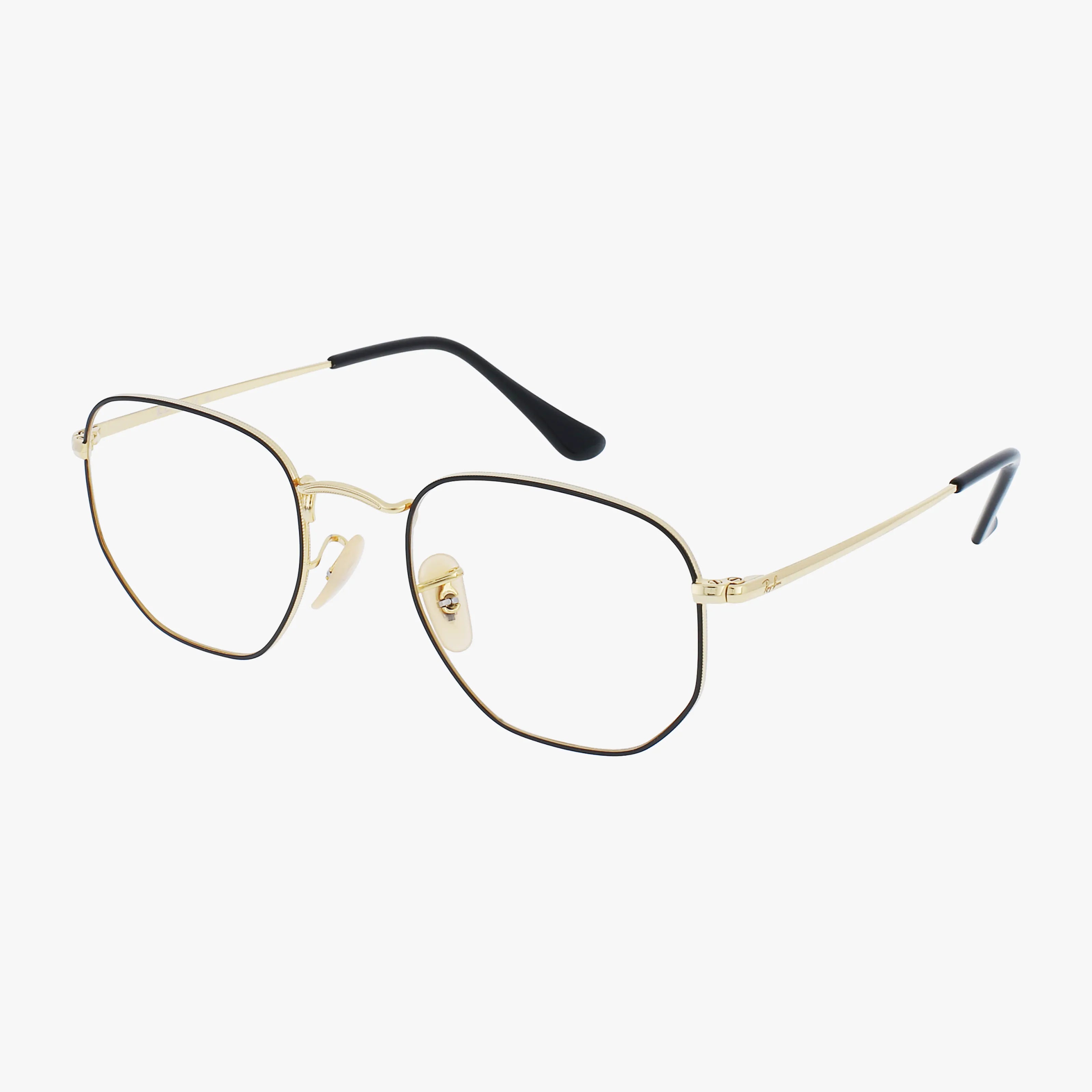 The RX6448 HEXAGONAL features gold metal eyeglasses with a durable frame, thin geometric lines, and black temple tips for stylish eyewear. Displayed on a white background.