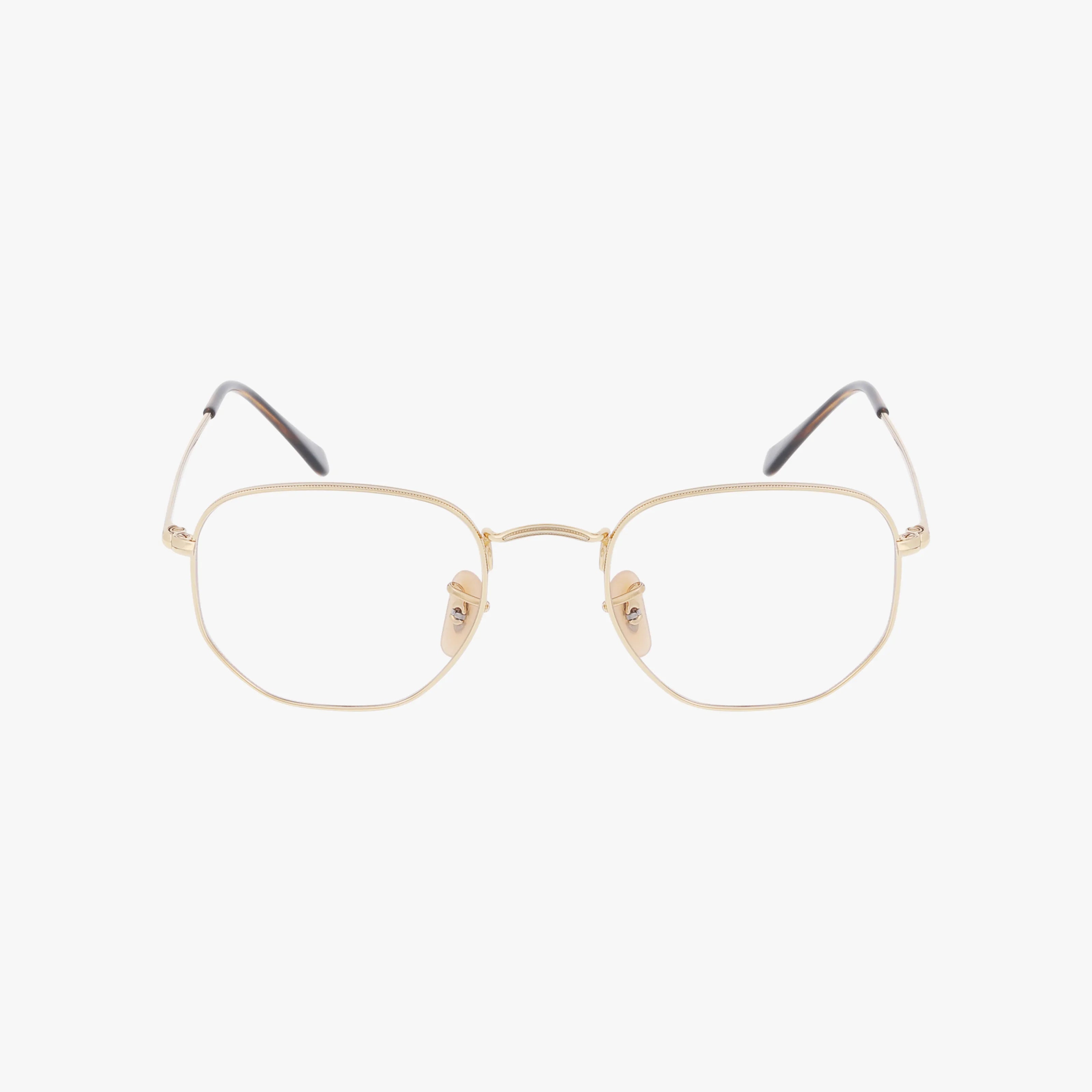 The RX6448 HEXAGONAL features gold wireframe eyeglasses with thin, hexagonal lenses and black-tipped temple arms, combining stylish design with a durable frame, shown against a white background.
