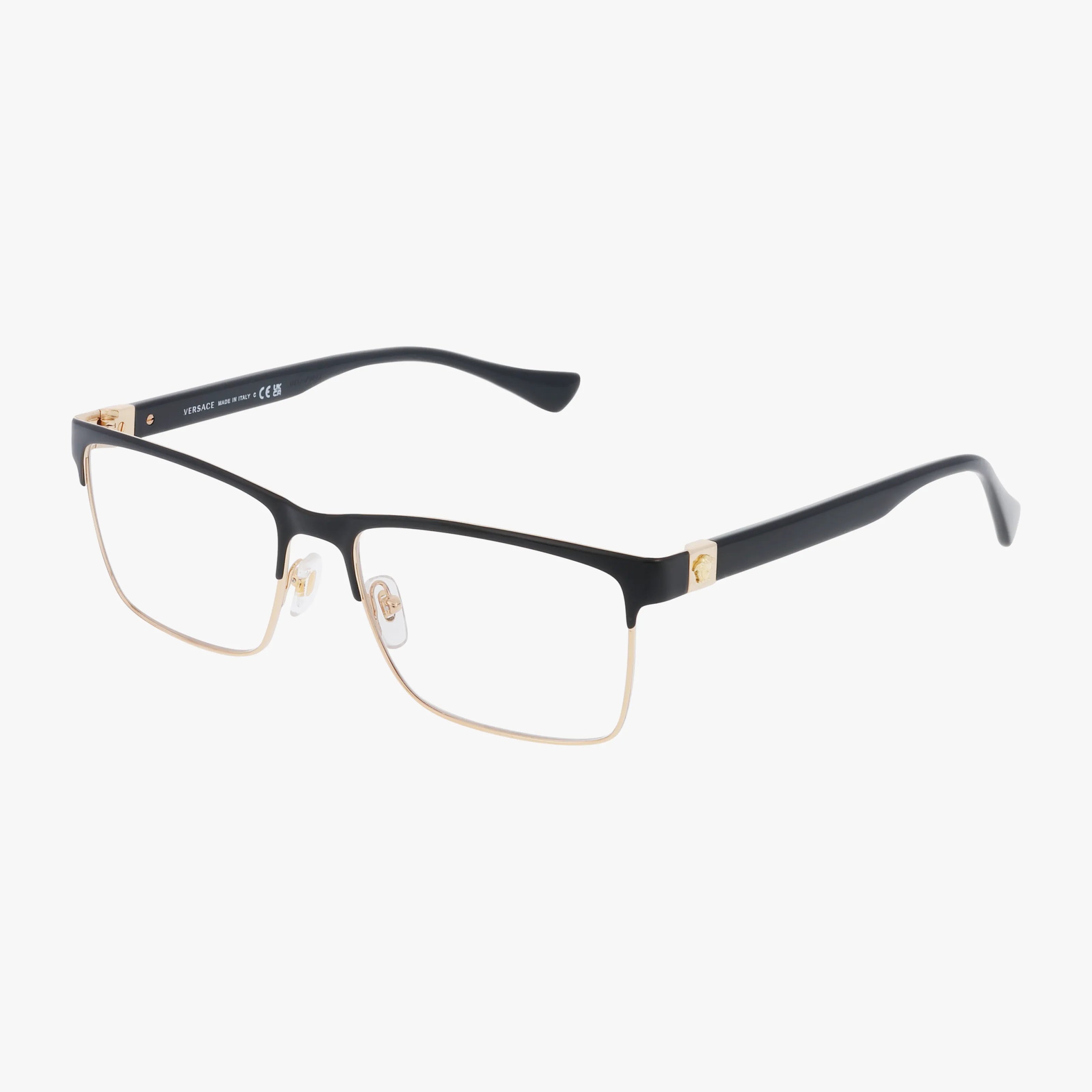 The VE1285 eyeglasses feature a rectangular design with prescription lenses, black upper rims, gold lower rims, and gold hinge accents. The black temples have subtly curved ends, creating a distinctive look against a plain white background.
