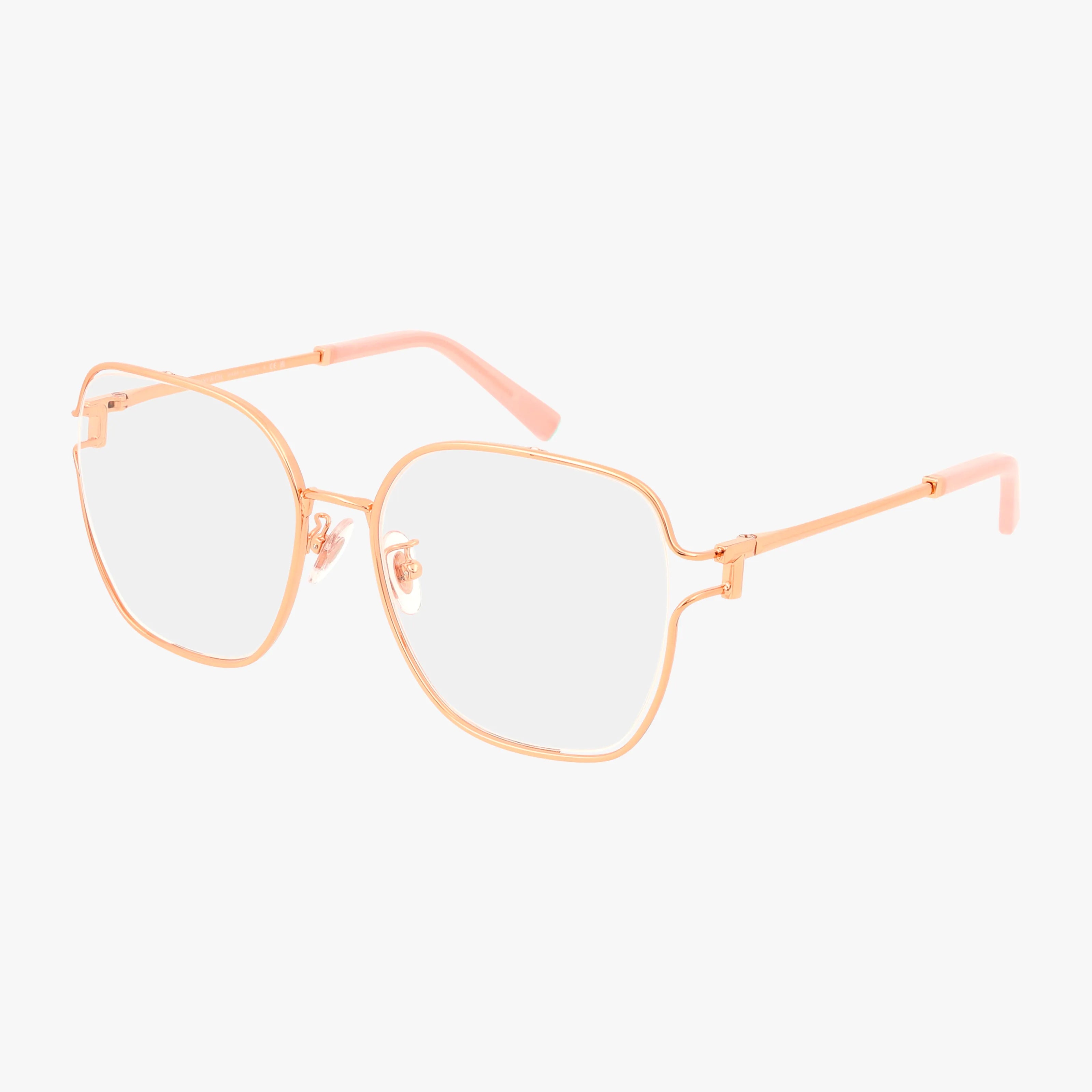 The TF1155D features gold metal eyeglasses with a resilient frame and large square lenses. Slim temples with pink tips add a contemporary touch, all set against a plain white background.