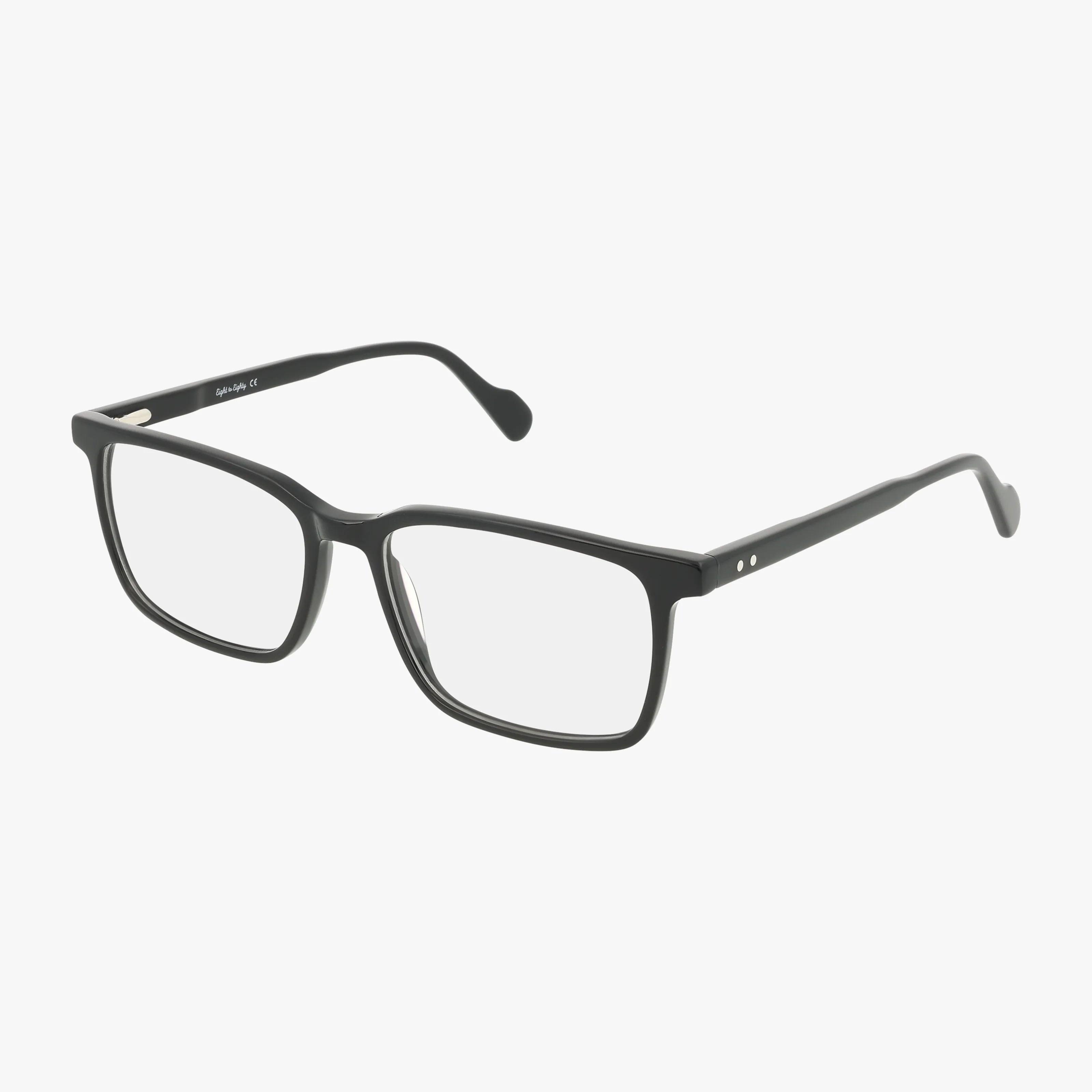 The ROGER eyeglasses are black rectangular frames with clear prescription lenses, shown on a white background. They feature a minimalist design, slightly curved arms, and silver accents near the hinges.