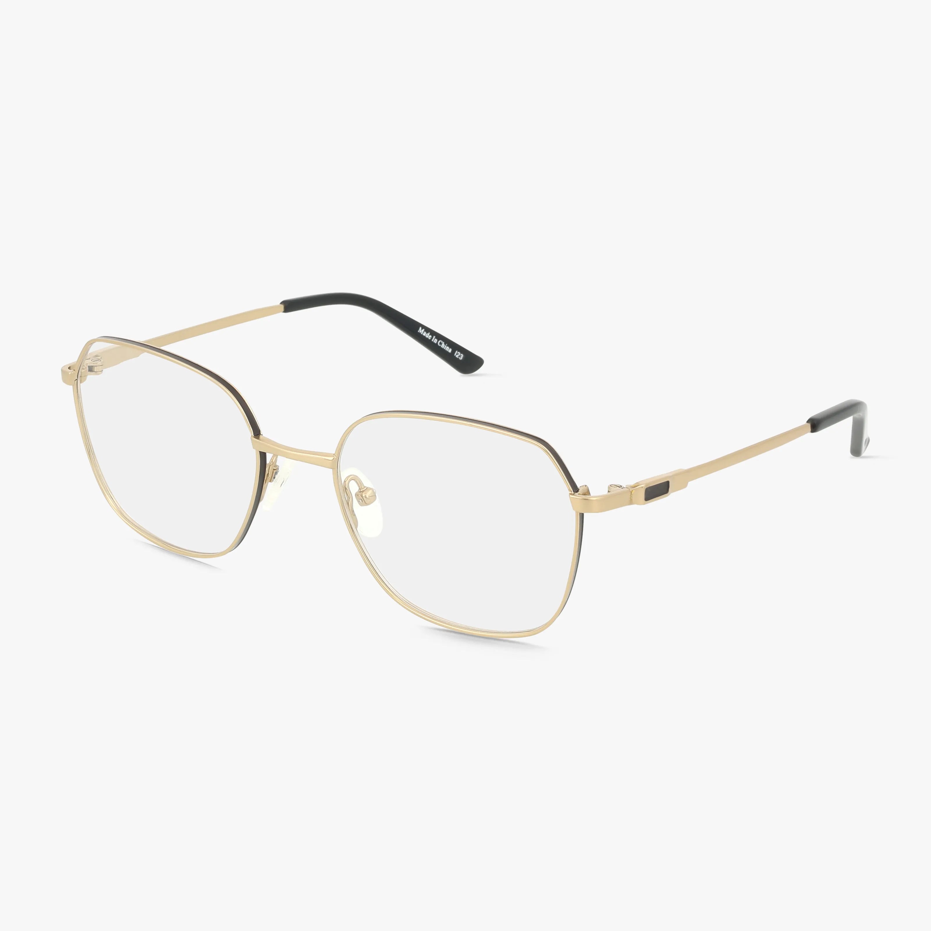 The 509 features gold metal eyeglasses with thin geometric frames and clear lenses. Slim temples with black tips and adjustable nose pads provide comfort. Perfect for everyday style, displayed against a white background.