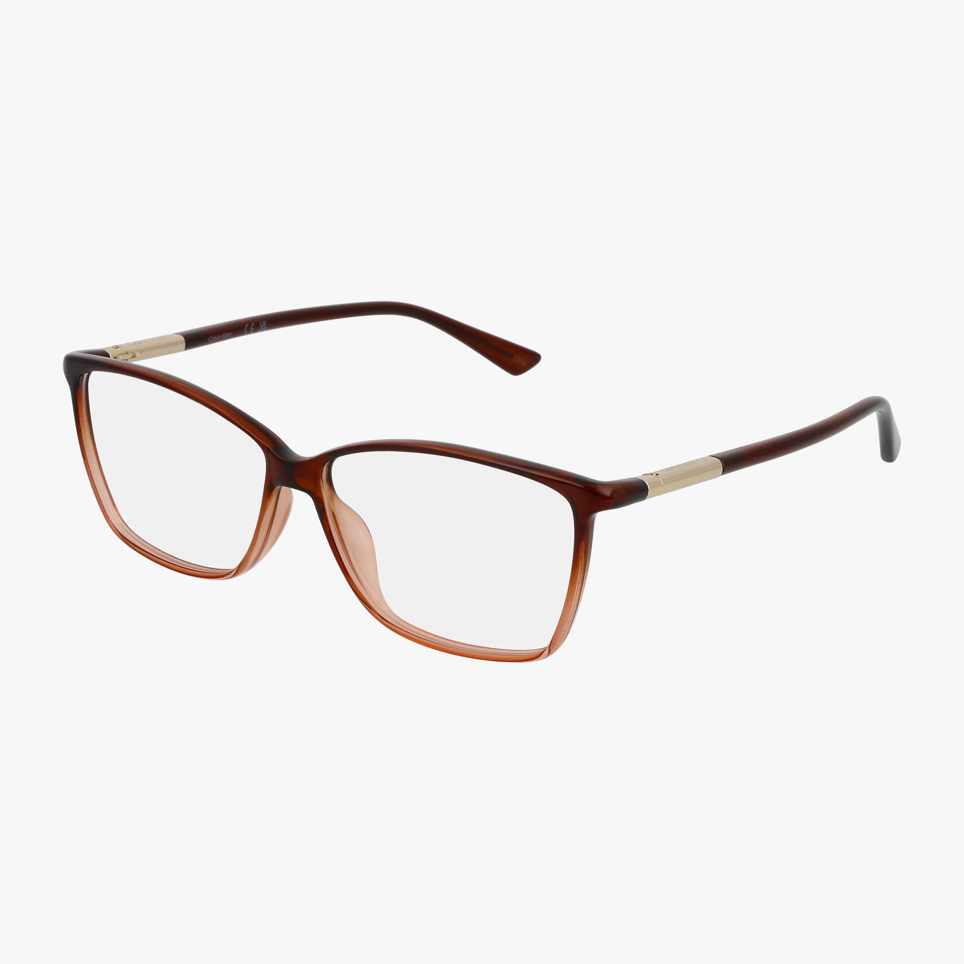 The CK21524 features brown, square-shaped eyeglass frames with transparent lenses and distinctive gold accents on the temples, presented against a white background.