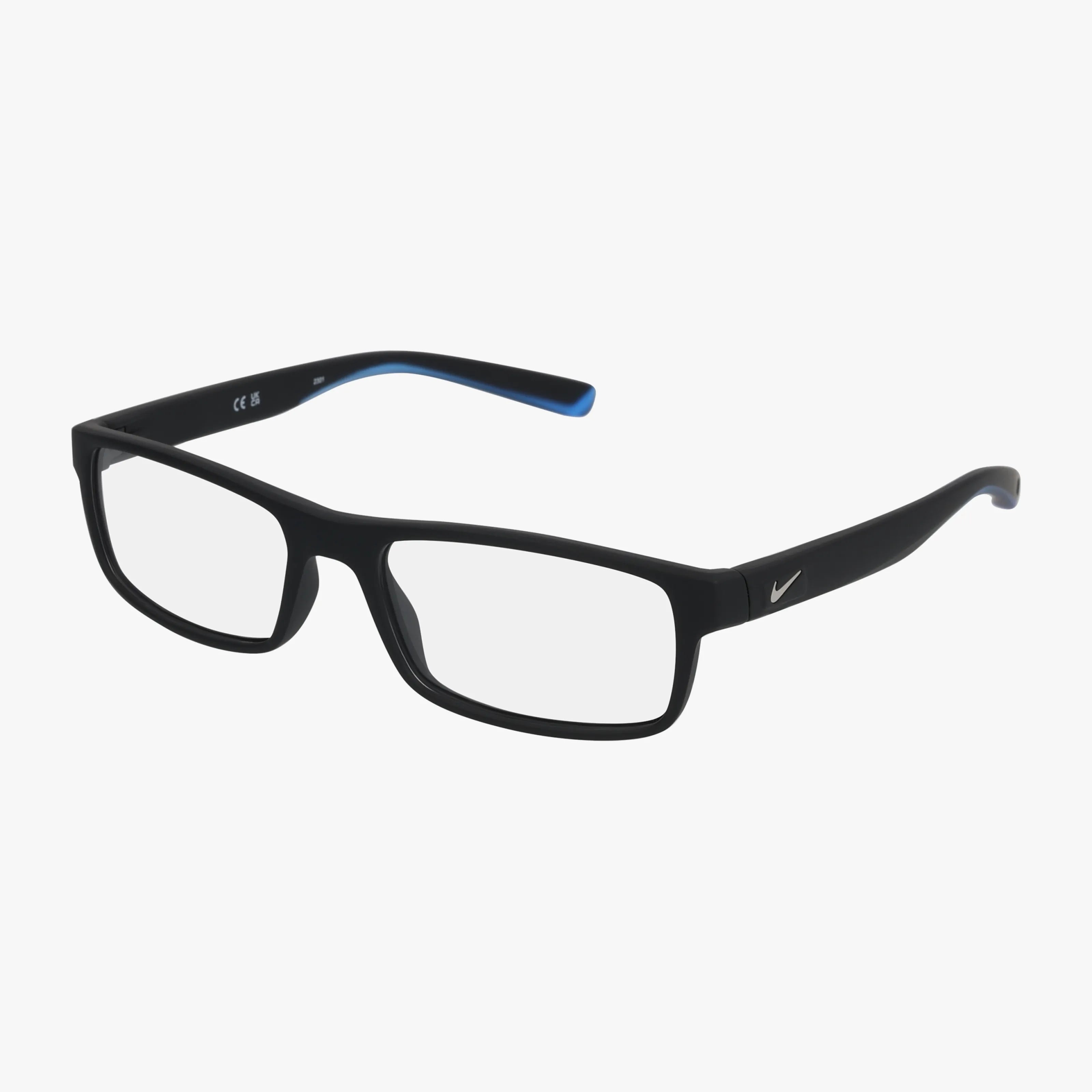 The NIKE 7090 eyeglasses are black and rectangular with clear lenses, a small silver Nike logo on the temple, and subtle blue accents on the inner arms, shown against a white background.
