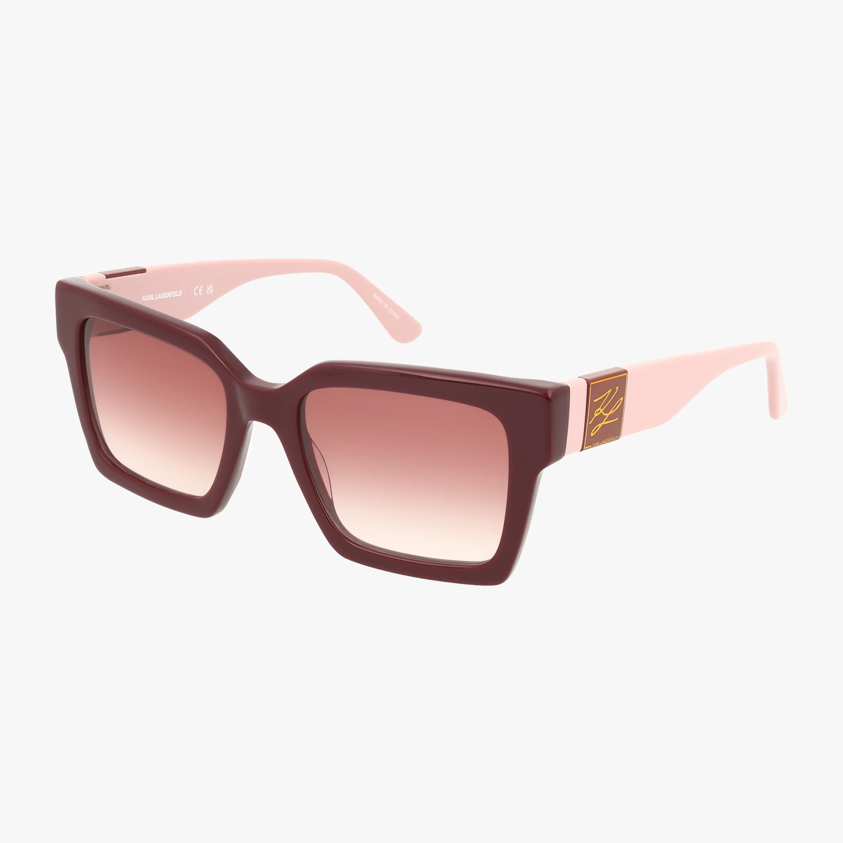 KL6057S are premium square sunglasses with a burgundy front, pink arms, and gradient pink lenses. Featuring UV protection and a gold temple logo, theyre showcased against a plain white background.