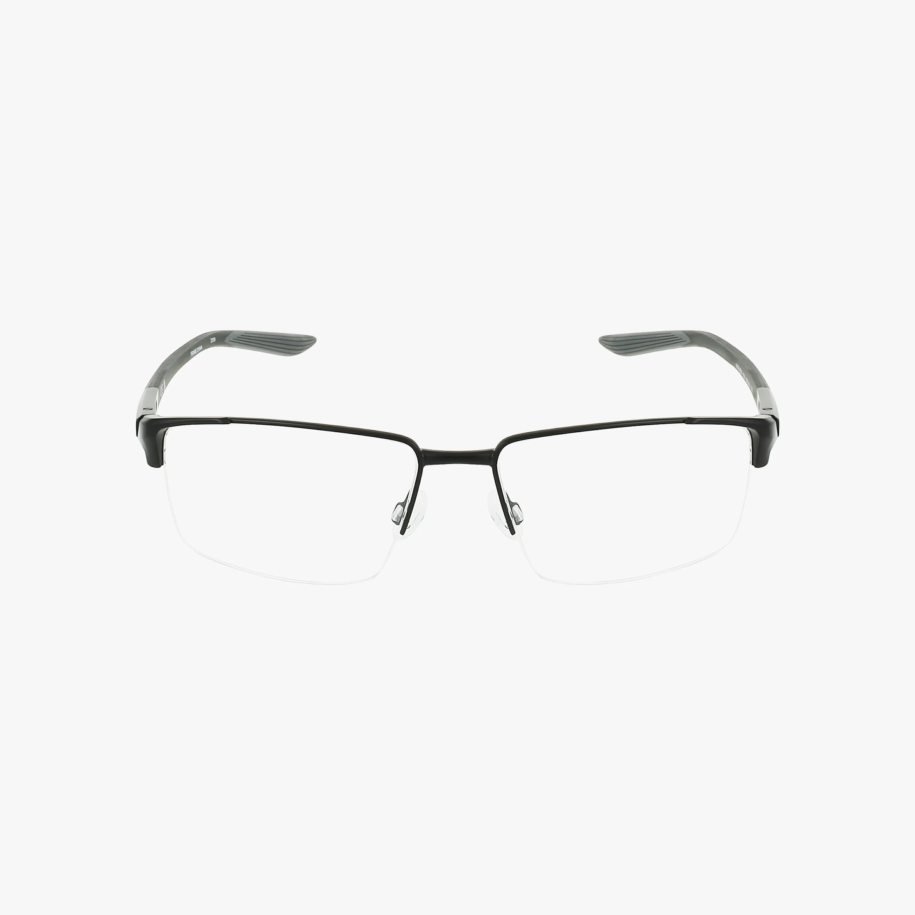 A pair of NIKE 8054 semi-rimless eyeglasses with a rectangular black frame and transparent nose pads, shown on a plain white background.