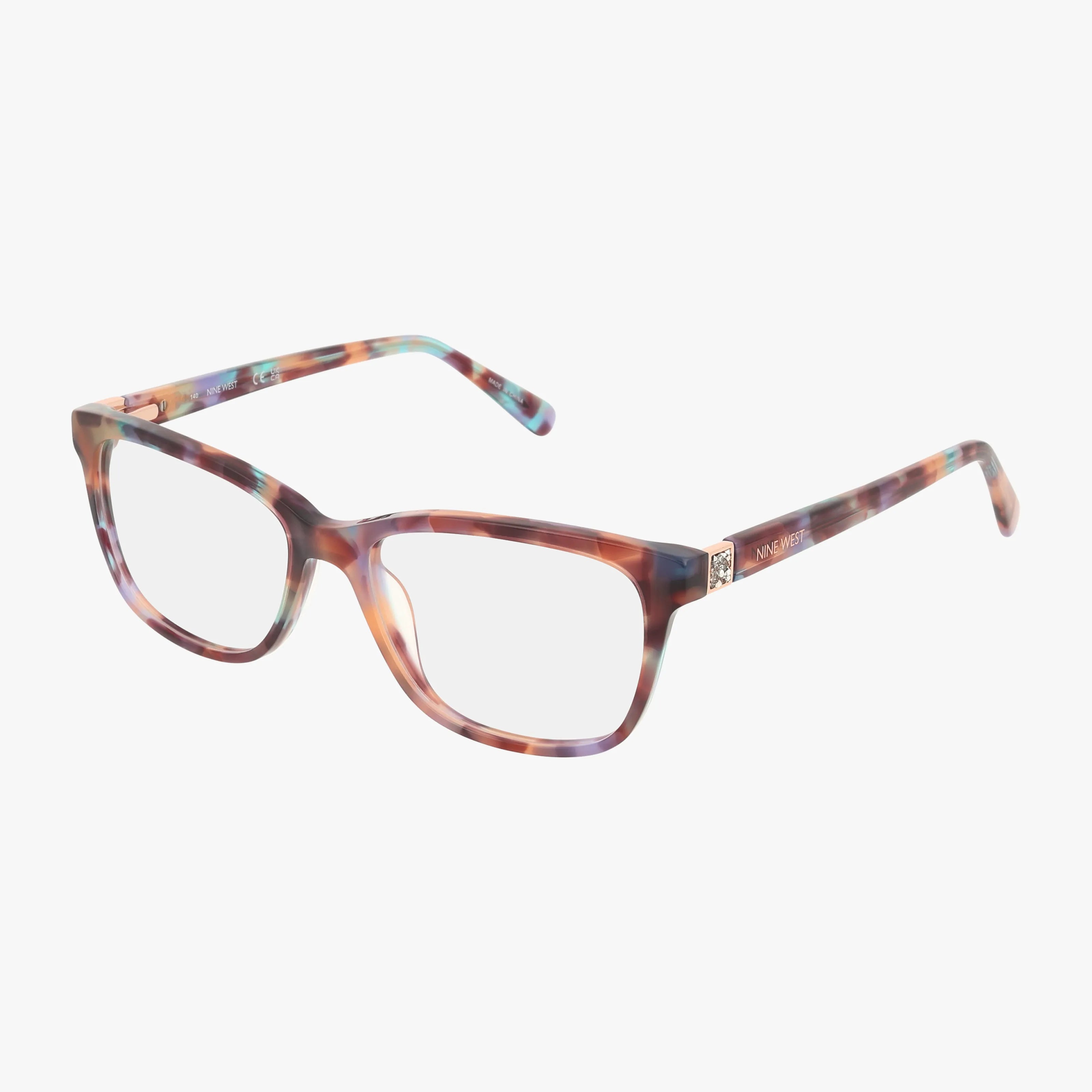 The NW5214 eyeglasses feature a rectangular shape and a marbled tortoise frame in brown, pink, and teal hues, shown against a white background.