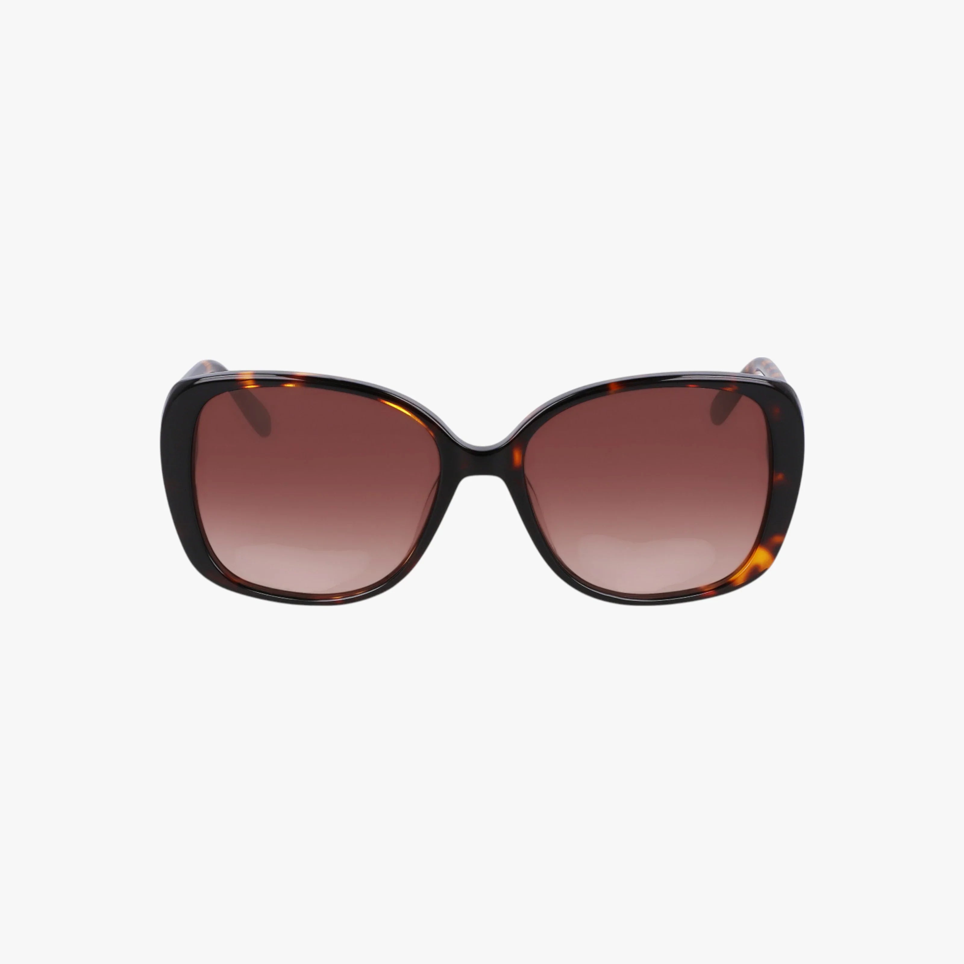 The NW657S sunglasses are stylish and oversized, featuring a tortoiseshell frame, brown-tinted lenses, and a sturdy build, displayed on a plain white background.