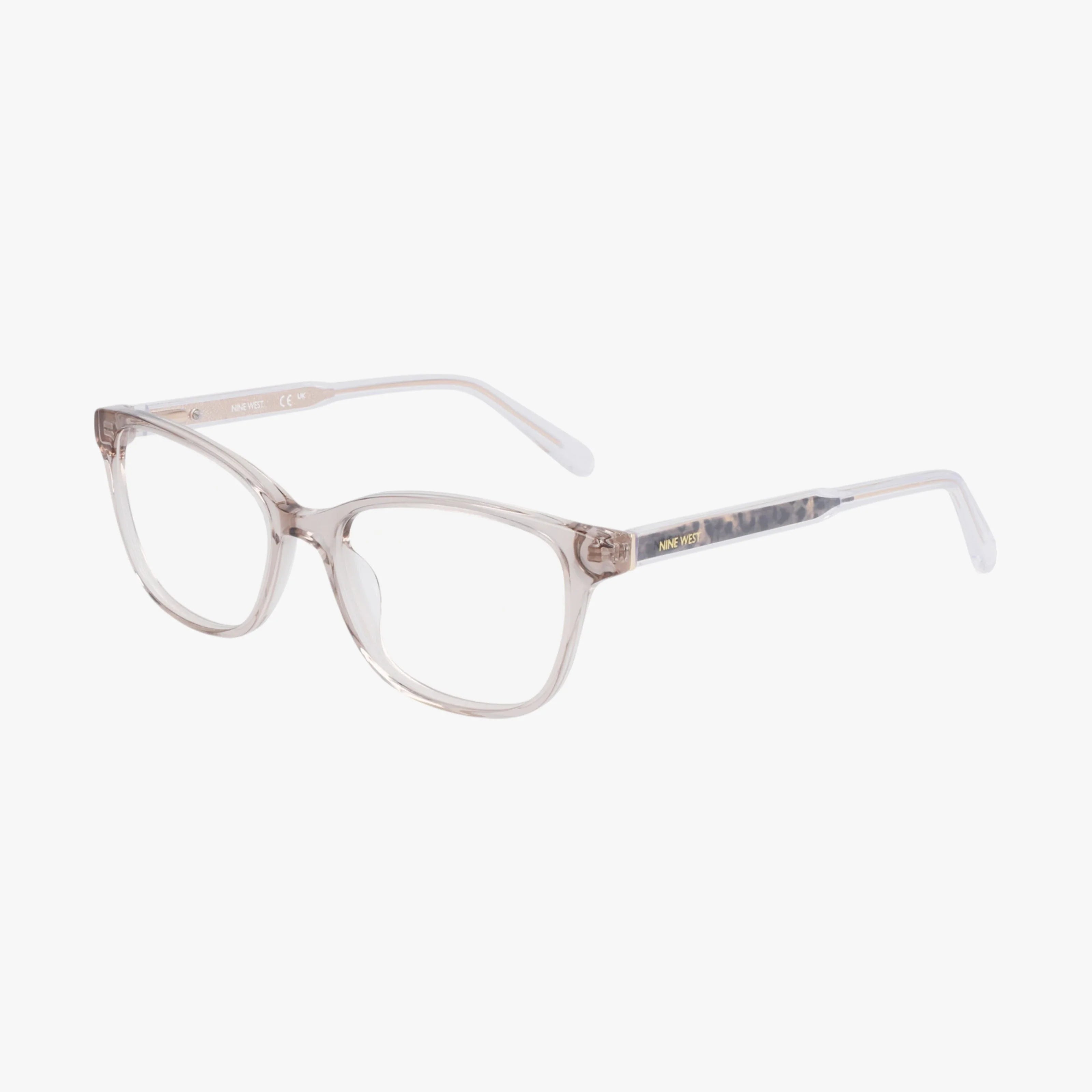 The NW5216 features clear plastic eyeglasses with a minimalist frame and rectangular lenses with softly rounded corners, displayed at an angle on a white background.