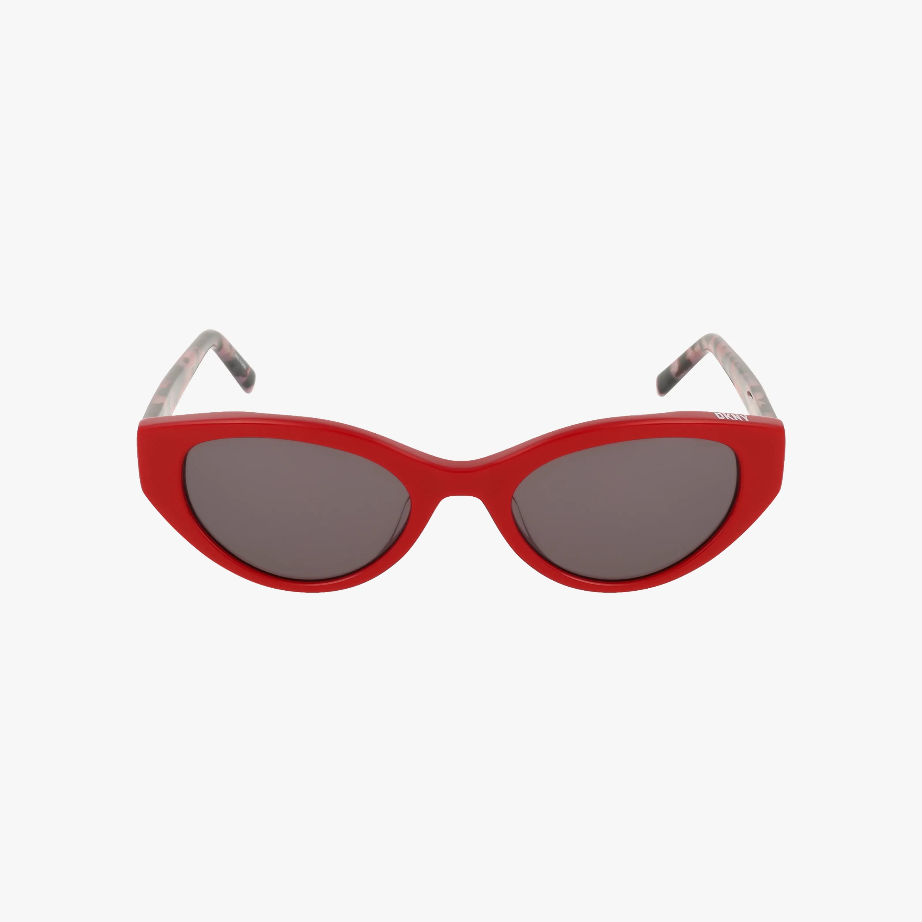 The DKNY DK548S sunglasses feature a red cat-eye shape, premium acetate frame, dark lenses, and patterned arms, displayed on a plain white background.