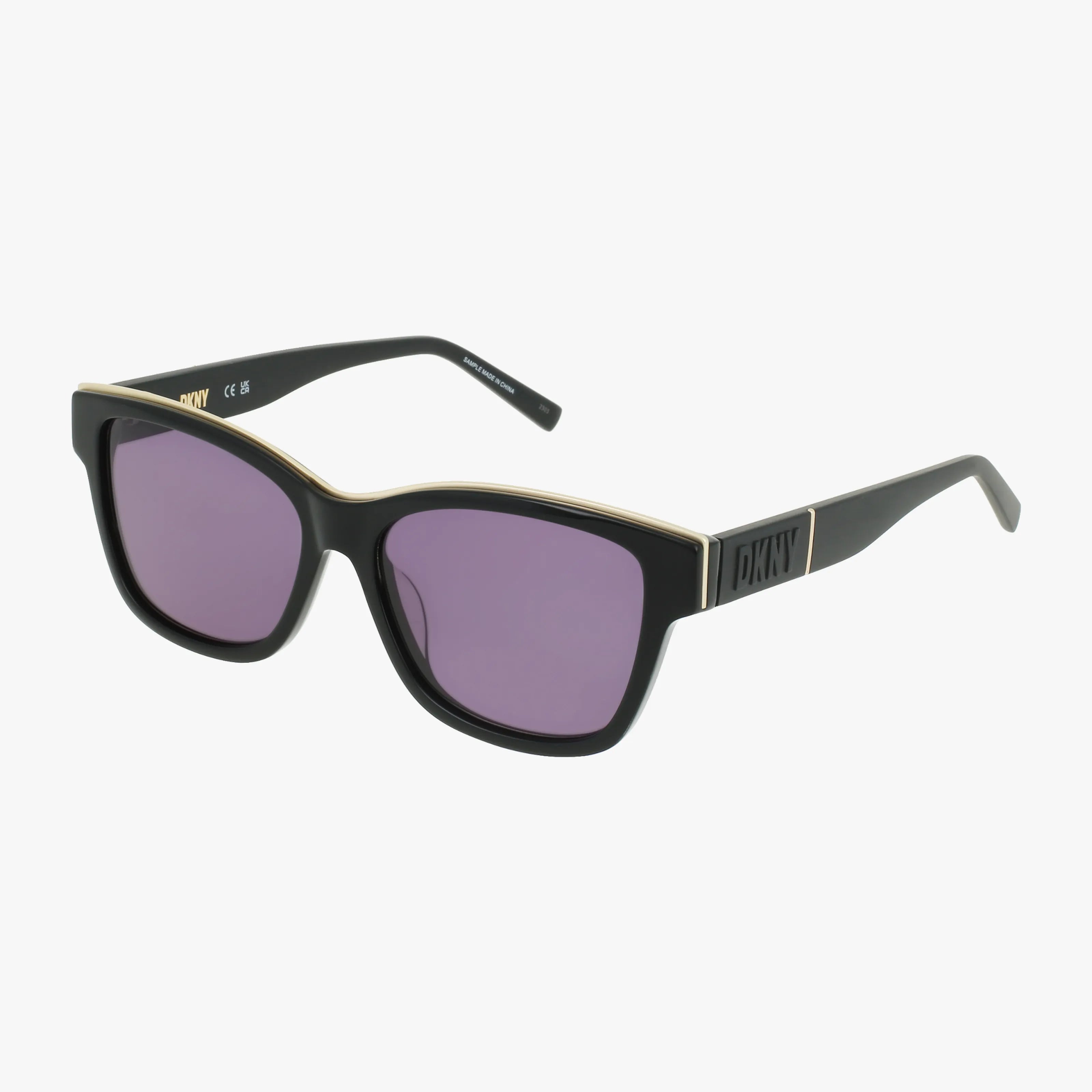 The DKNY DK549S black rectangular sunglasses feature urban chic style with purple lenses, gold accents on the frame, and the DKNY logo on the arms, shown against a white background.