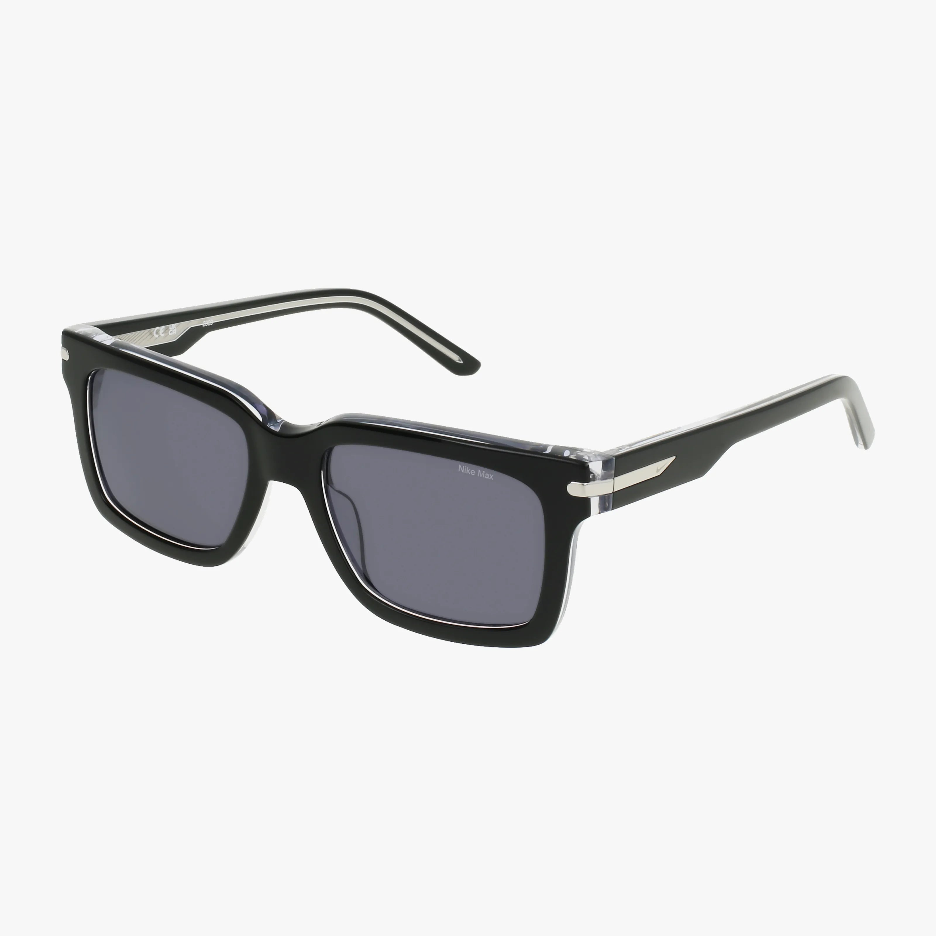 The NIKE EV24017 black rectangular sunglasses feature thick rims, dark lenses, and silver temple accents. Perfect for outdoor adventures, these stylish sunglasses are now available to buy glasses online. Displayed on a white background.