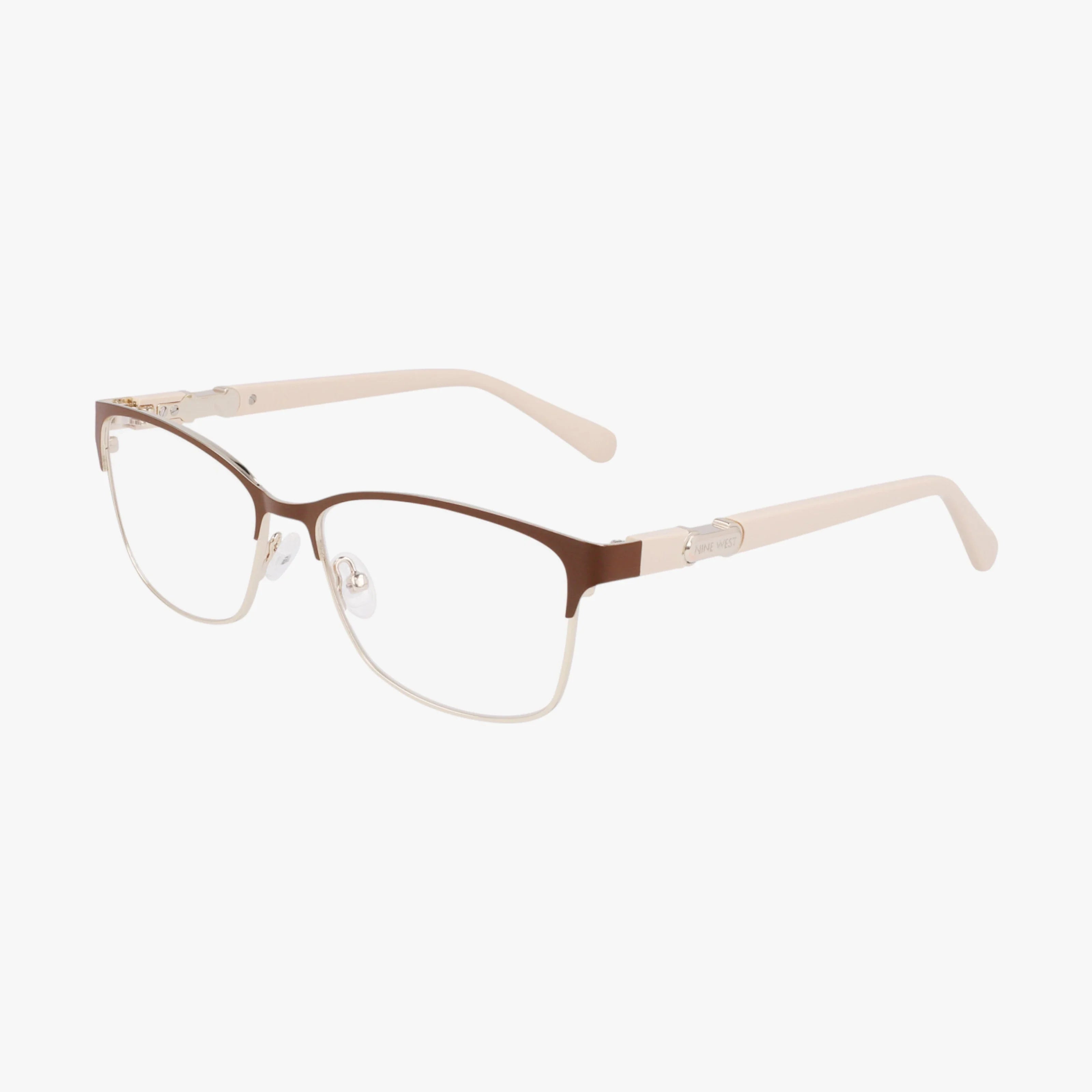 The NW8023 eyewear features a brown and gold metal frame, clear nose pads, light beige arms, and blue light lenses, presented on a plain white background.