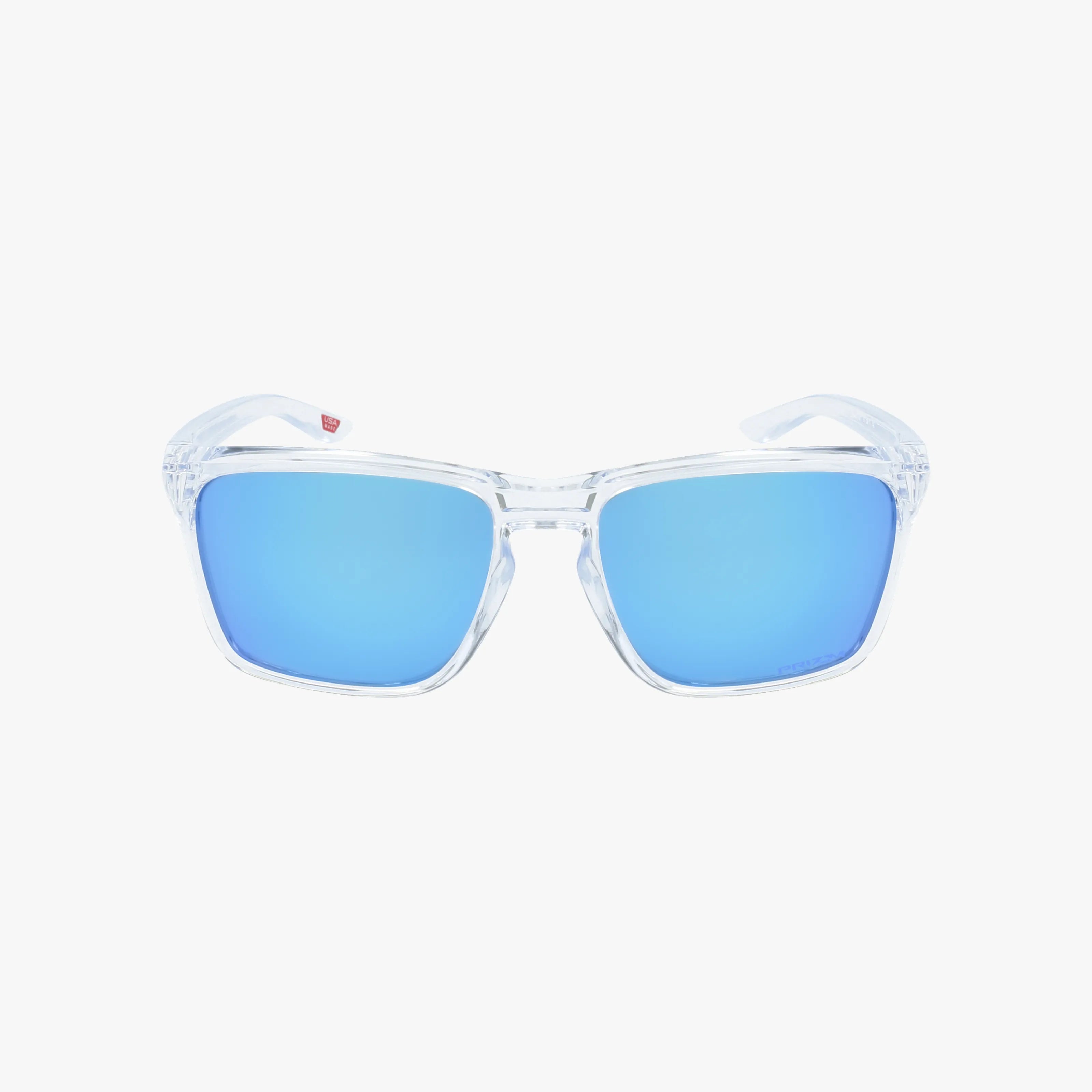 The OO9448 SILVER STEALTH sunglasses feature clear frames and reflective blue lenses, displayed against a plain white background for a bold, modern look.
