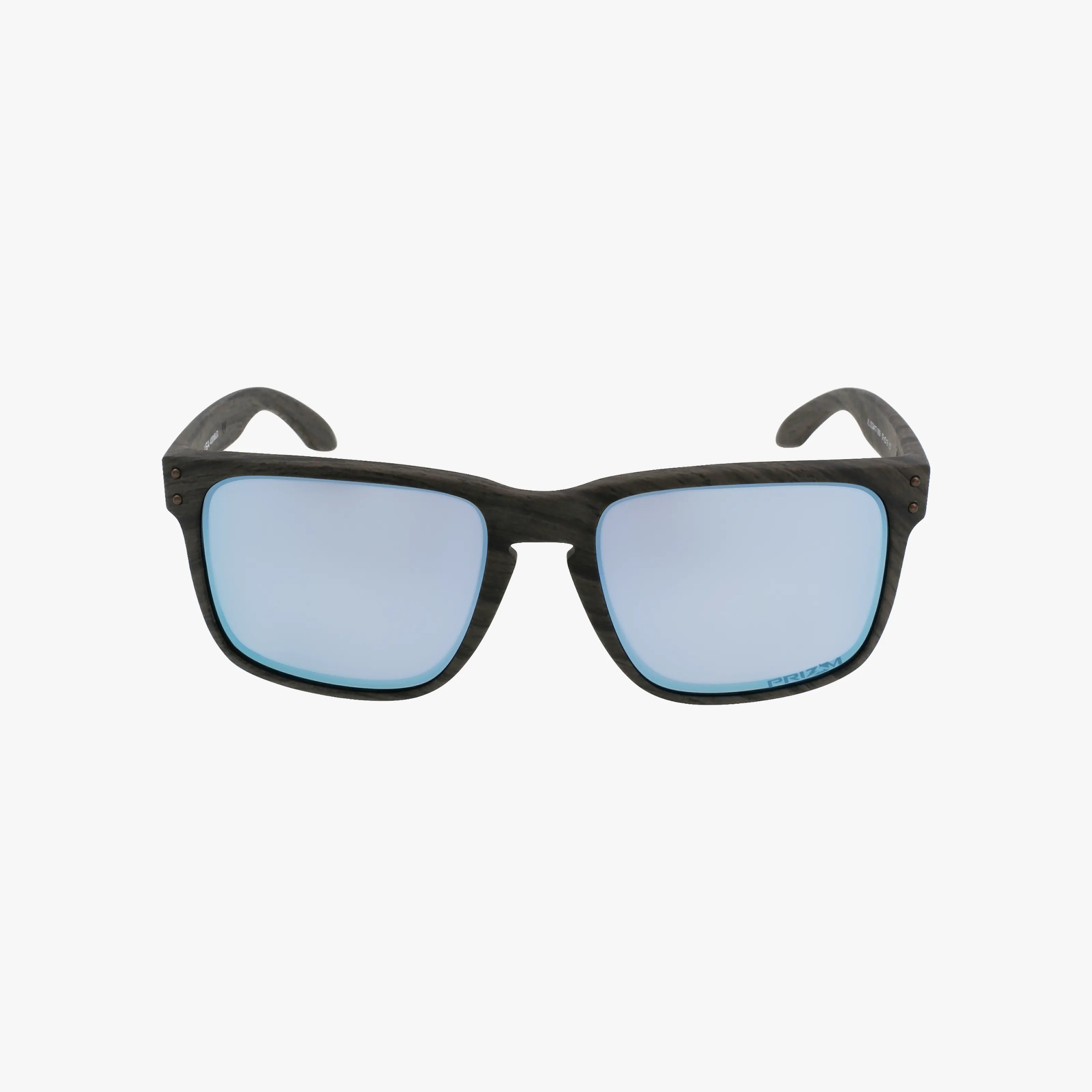 OO9417 HOLBROOK XL sunglasses featuring rectangular, light blue reflective lenses and dark, wood-grain patterned lightweight frames are displayed facing forward on a plain white background.