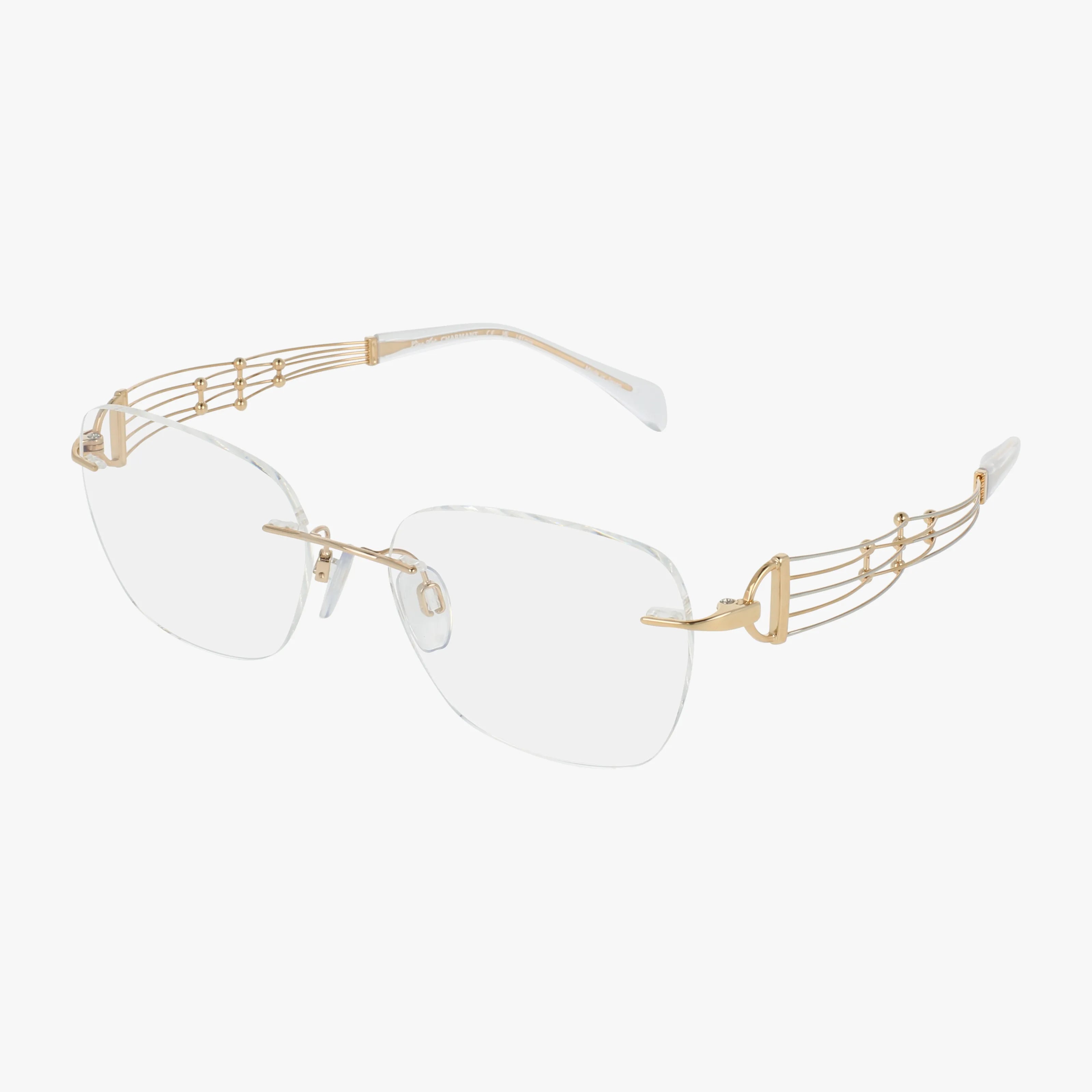 The 2183 features rimless rectangular prescription lenses, gold decorative arms with a music staff-inspired design, and clear plastic temple tips—delivering a truly minimalist frame.