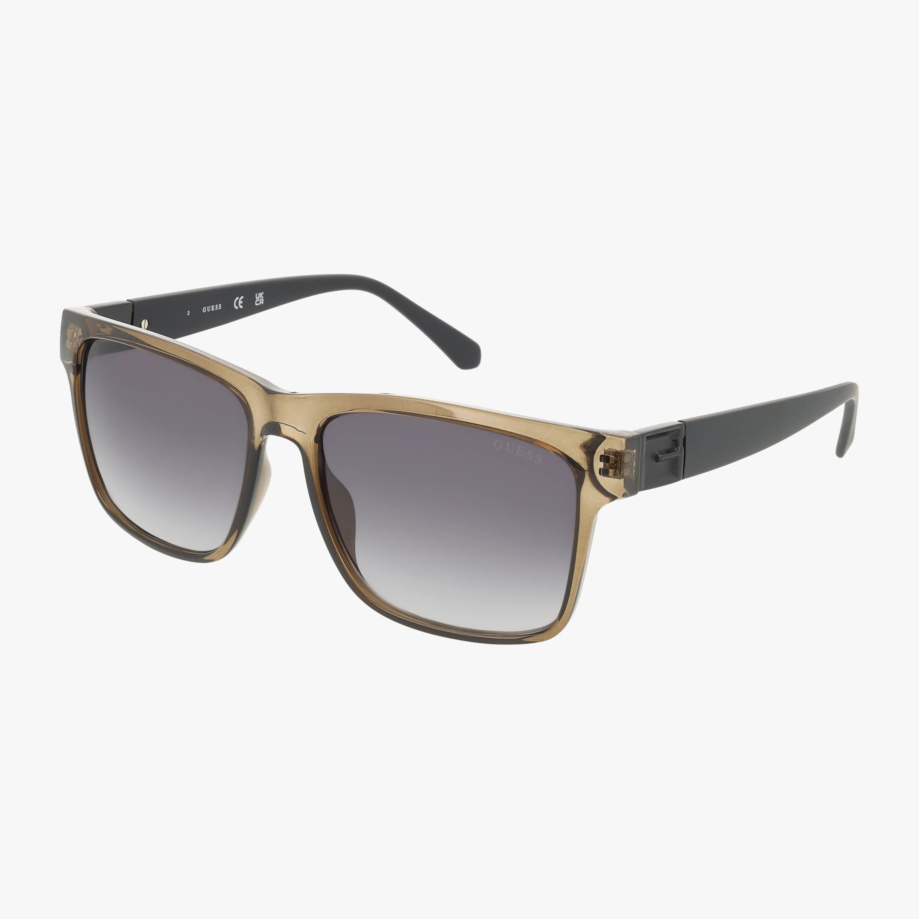 The GU00004S sunglasses feature square light brown translucent frames, black arms, and dark gradient lenses—ideal for online shopping—shown on a white background.