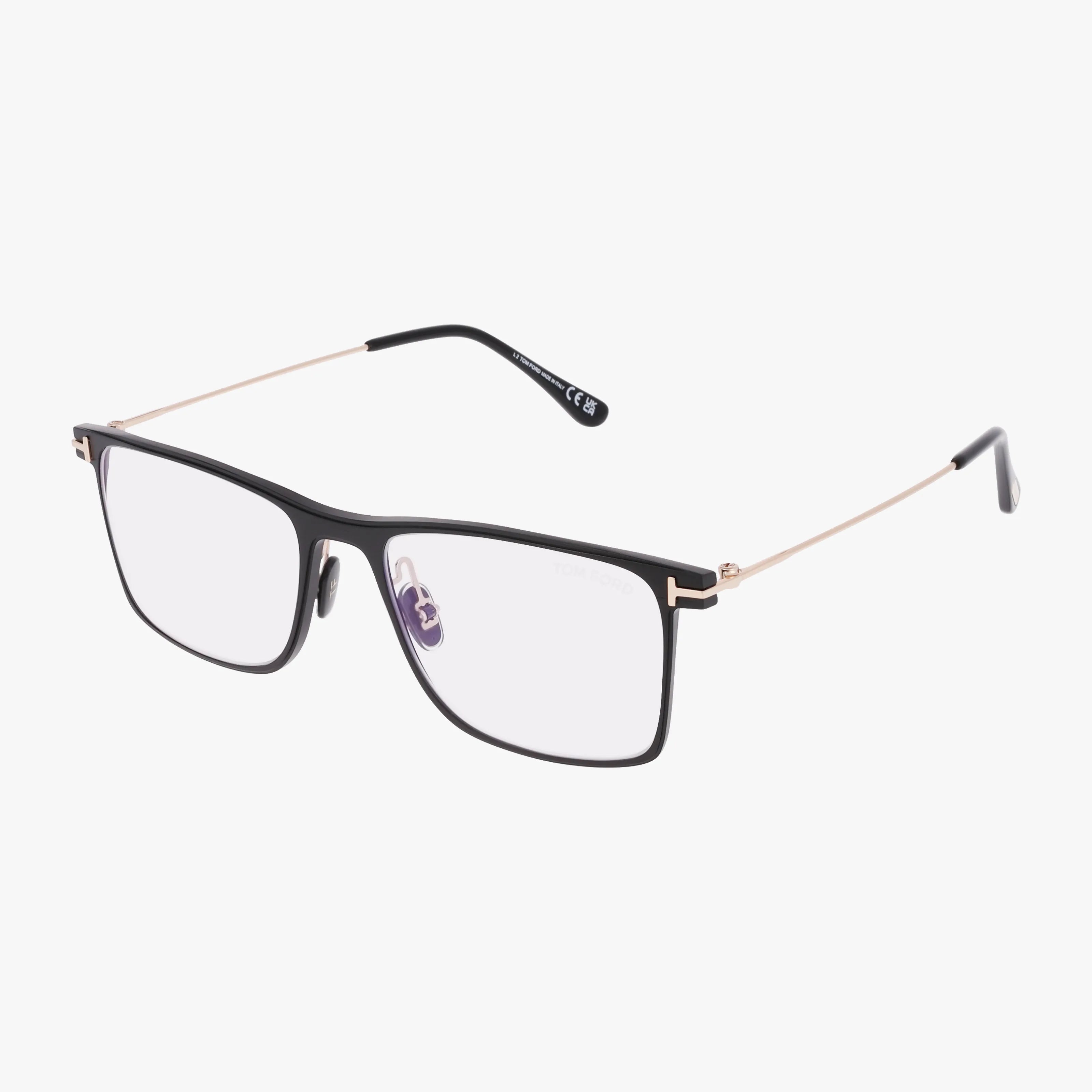The FT5865-B features rectangular eyeglasses with a sleek black frame, thin gold metal arms, clear lenses, and adjustable nose pads—versatile eyewear displayed on a white background.