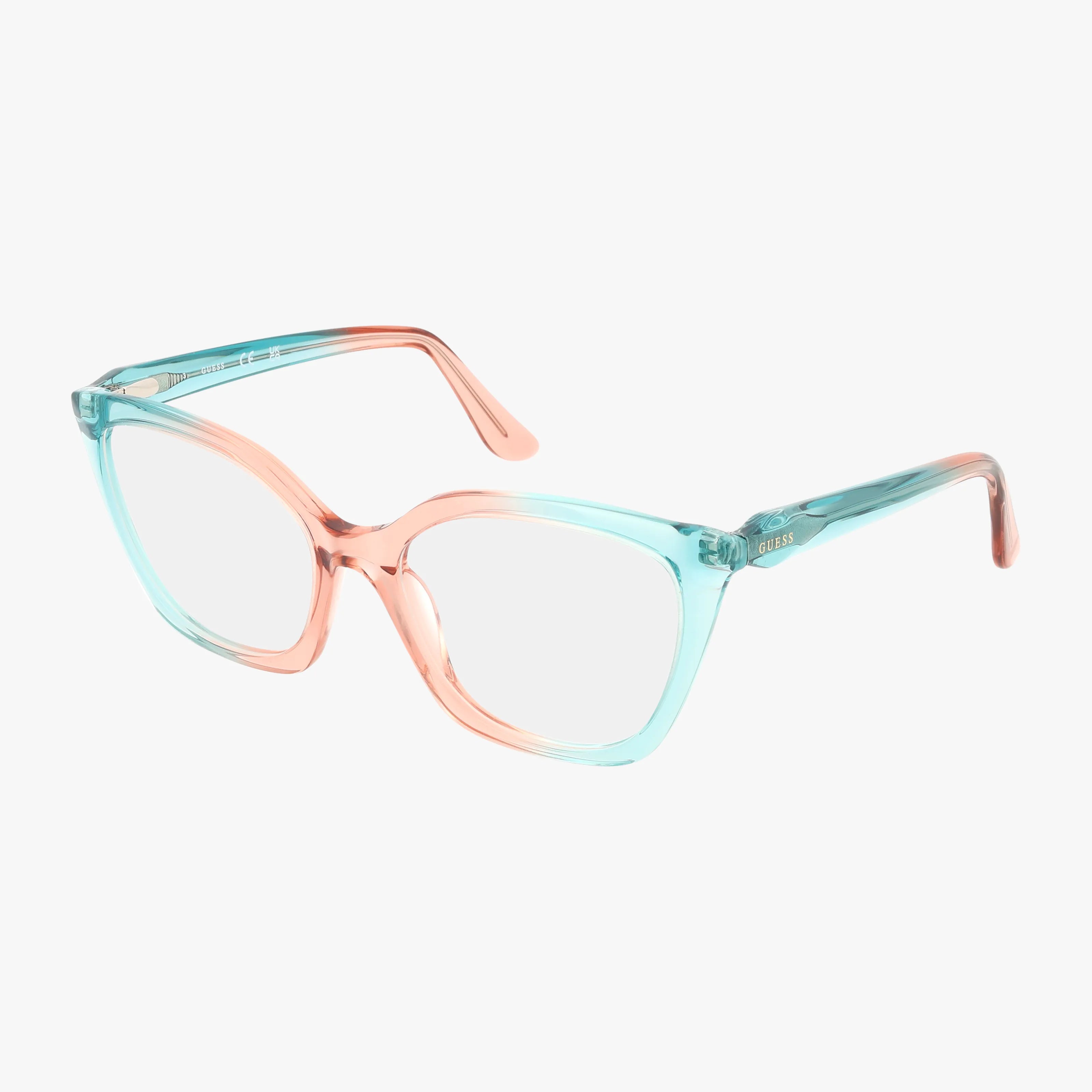 The GU2965 eyewear features translucent frames with a gradient design—light blue on the outer sides blending into light pink at the bridge—crafted with modern construction and shown on a plain white background.