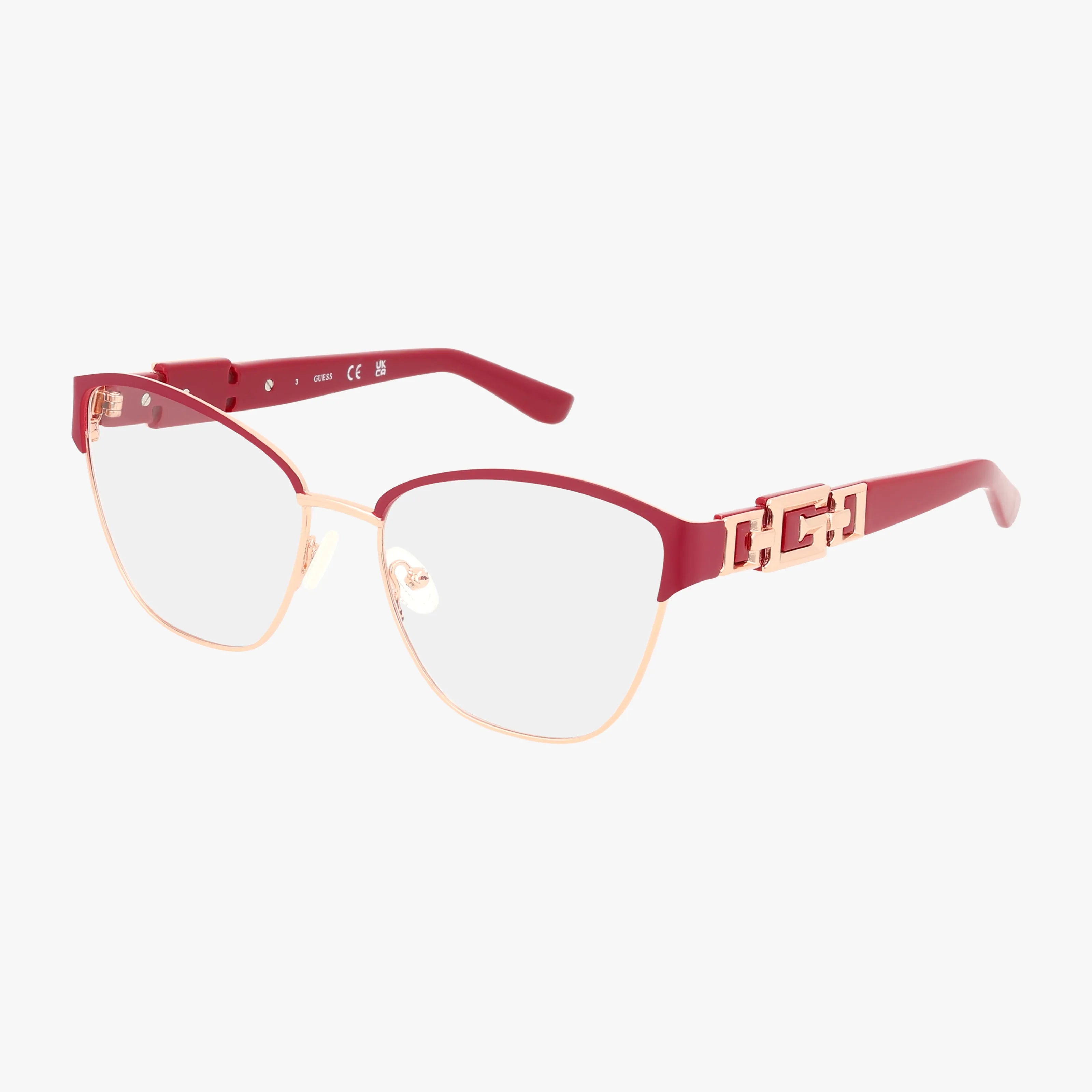 The GU2984/V eyeglasses feature gold rims, red accents, a modern frame with geometric arm design, and clear prescription lenses, all displayed on a white background.