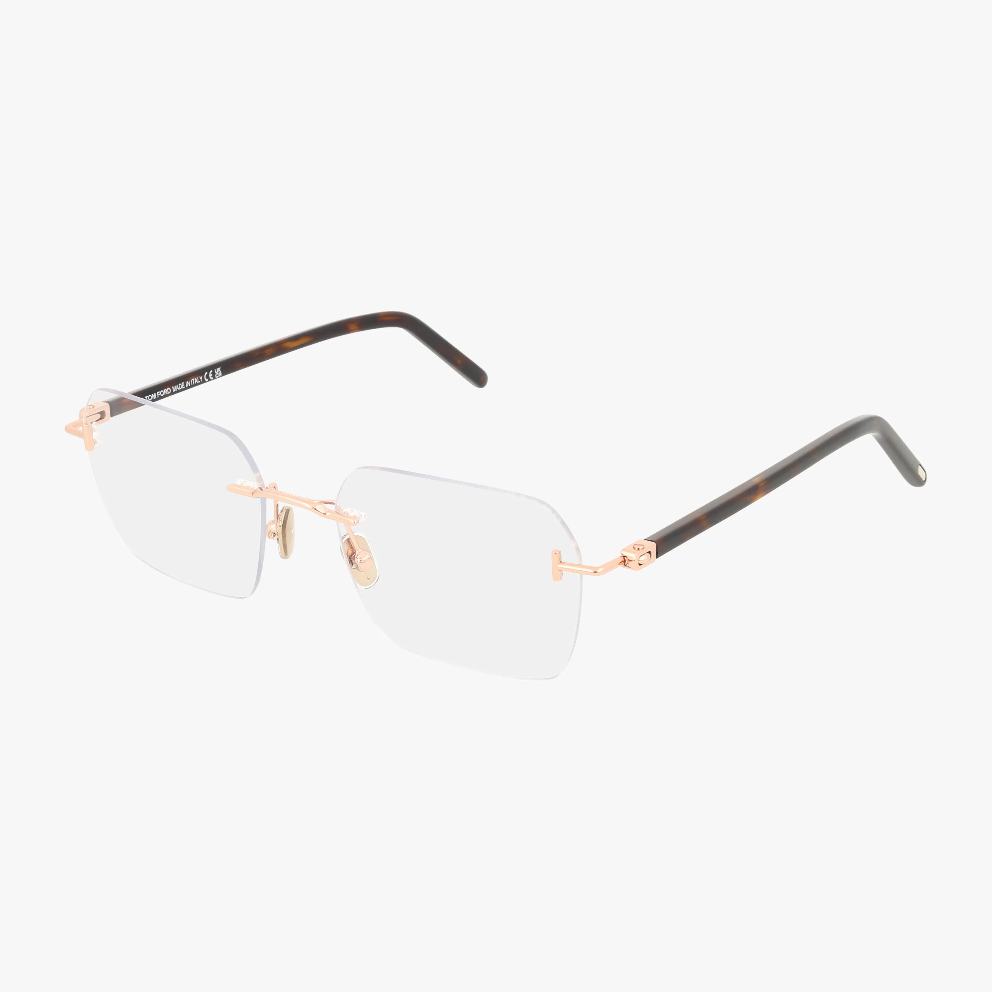 FT5934-B rimless eyeglasses feature square clear lenses, a sleek gold metal bridge and temples, plus dark tortoiseshell-patterned tips. This stylish eyewear is shown on a white background.