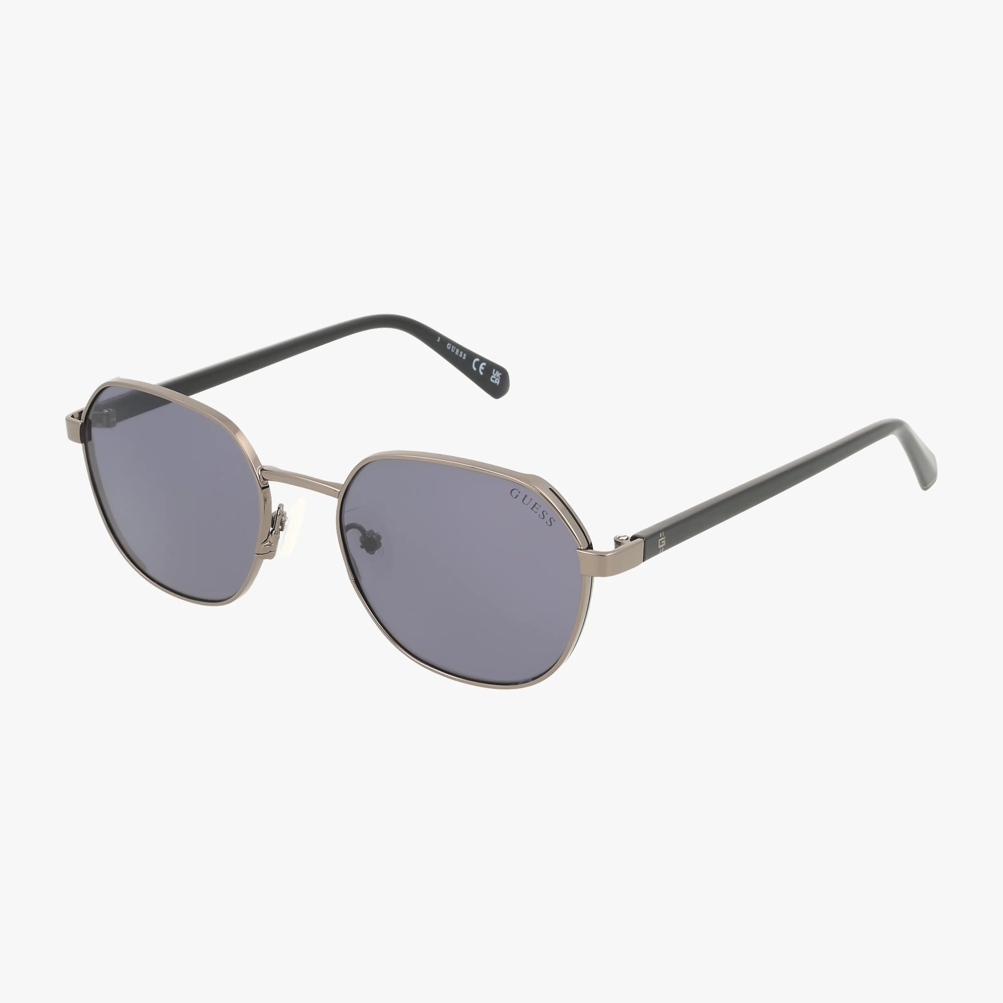 Elevate your eyewear collection with the GU00116 sunglasses, featuring thin gold metal frames, dark gray oval lenses, and black arms. Displayed on a white background for easy online shopping inspiration.