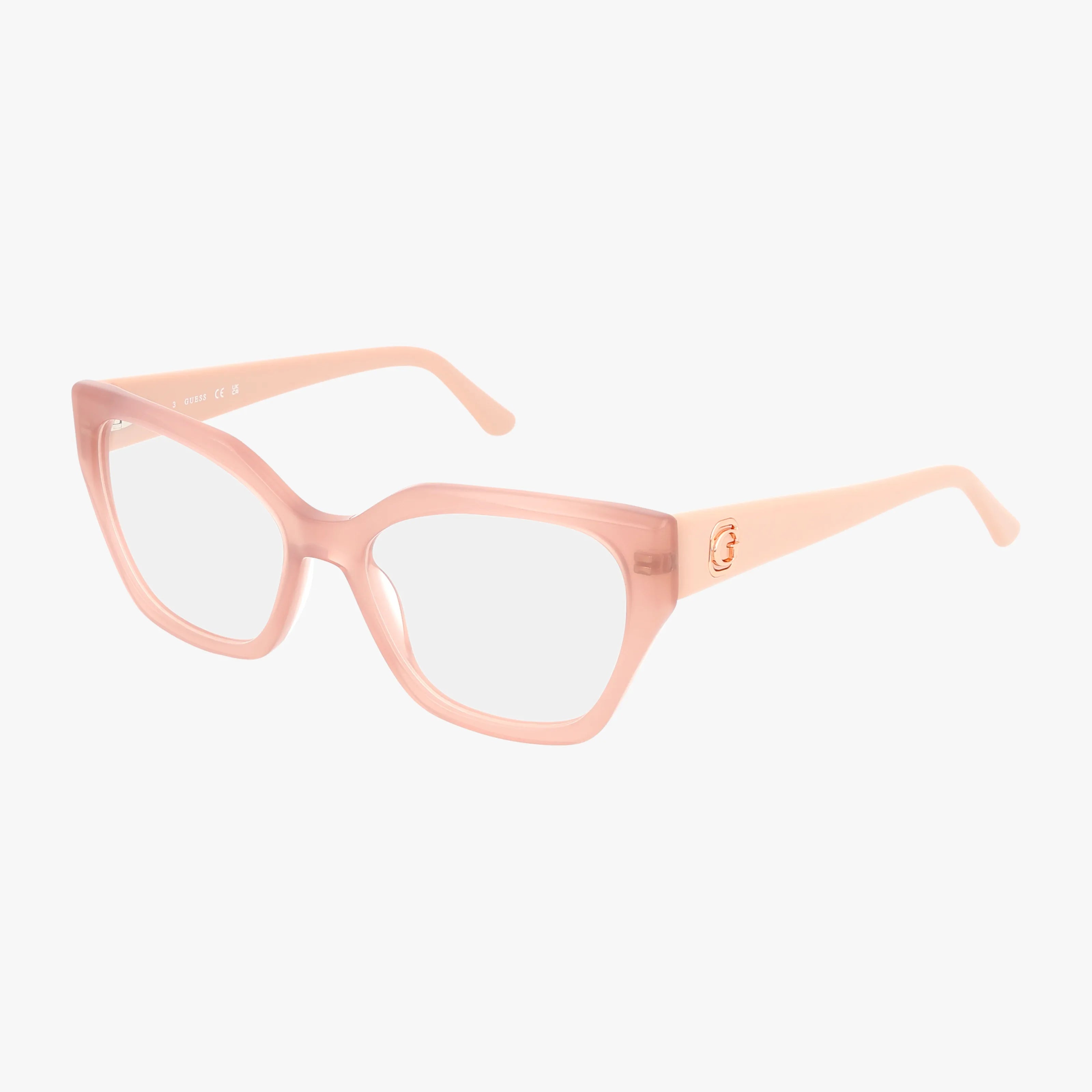 The GU50112 features oversized square eyeglasses in light pink with clear lenses and a luxurious frame. Thick arms showcase quality craftsmanship with a small gold detail at the hinge, displayed on a plain white background.