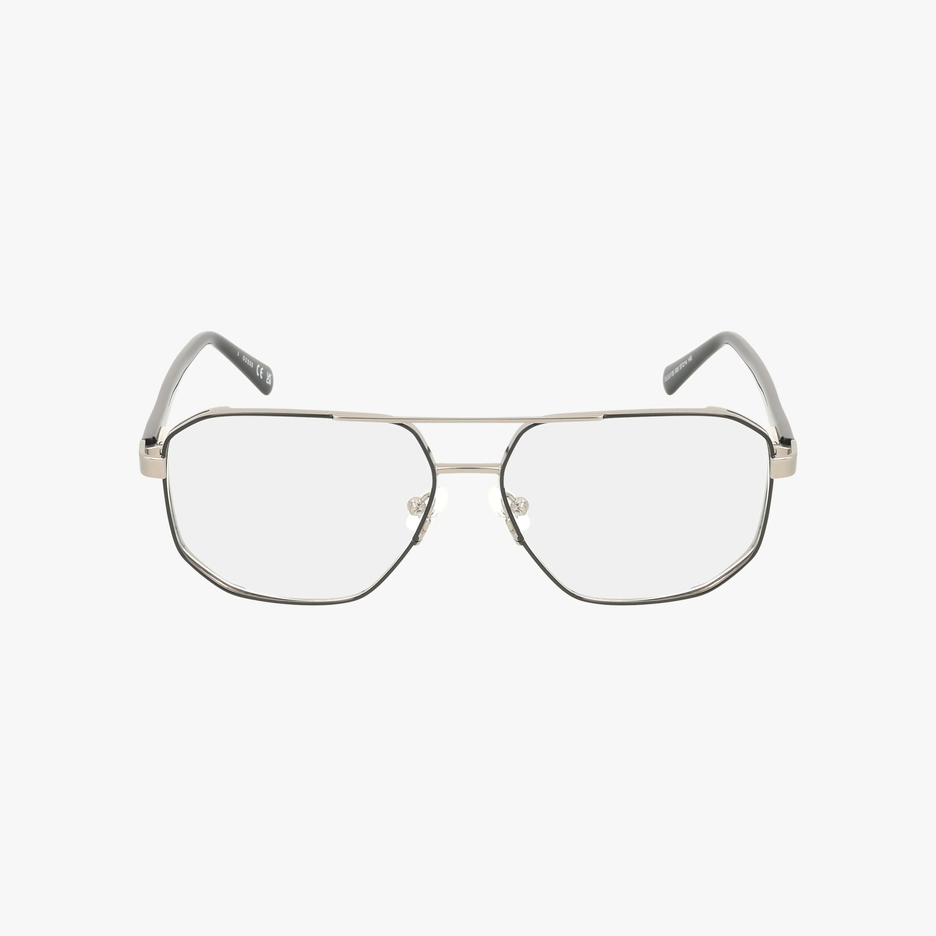 The GU50135/V features silver metal frames with a chic design and large geometric lenses, plus clear nose pads for comfort, displayed on a plain white background.