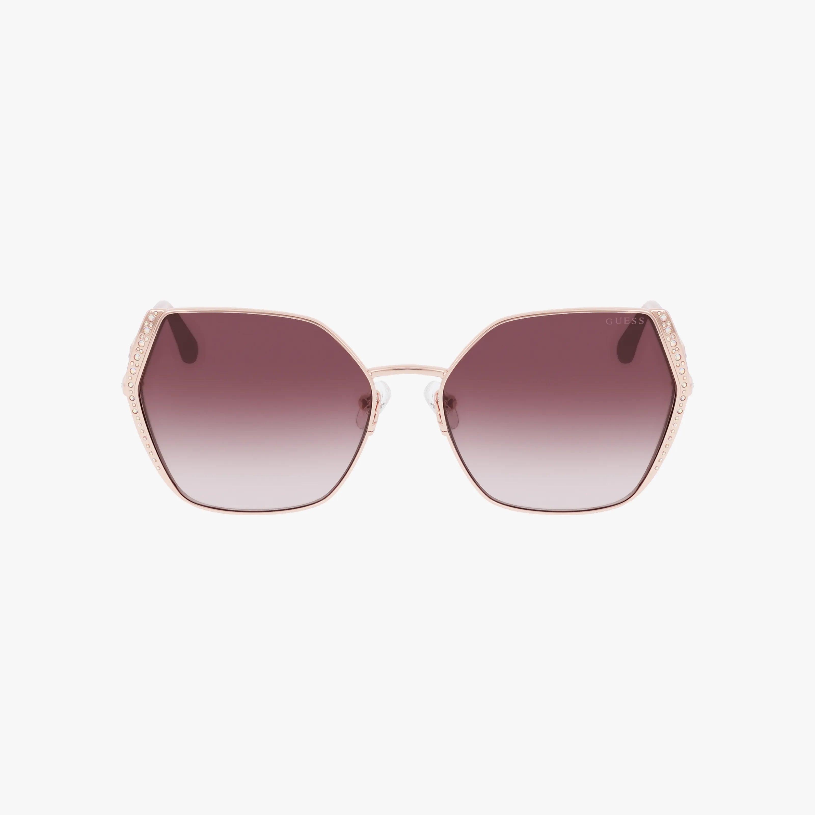 The GU7843S sunglasses feature large hexagonal frames with gradient lenses, a light-colored durable build, and decorative temple details for a standout, bold look.
