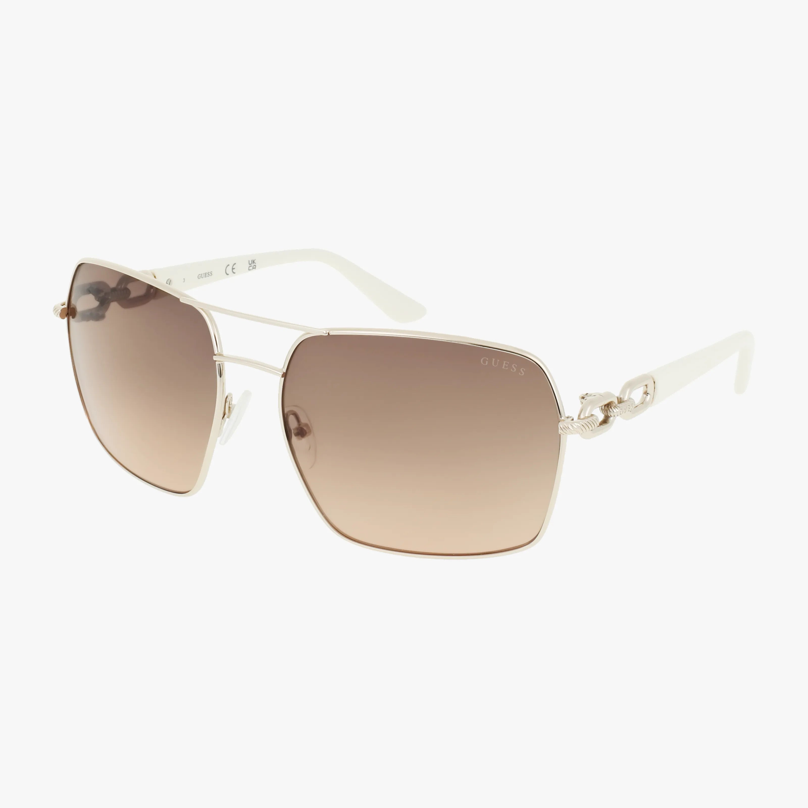 The GU00159S by Guess are stylish sunglasses featuring oversized square lenses, gold metal frames, white arms with a knot detail near the hinges, and brown-tinted gradient premium lenses for excellent protection.