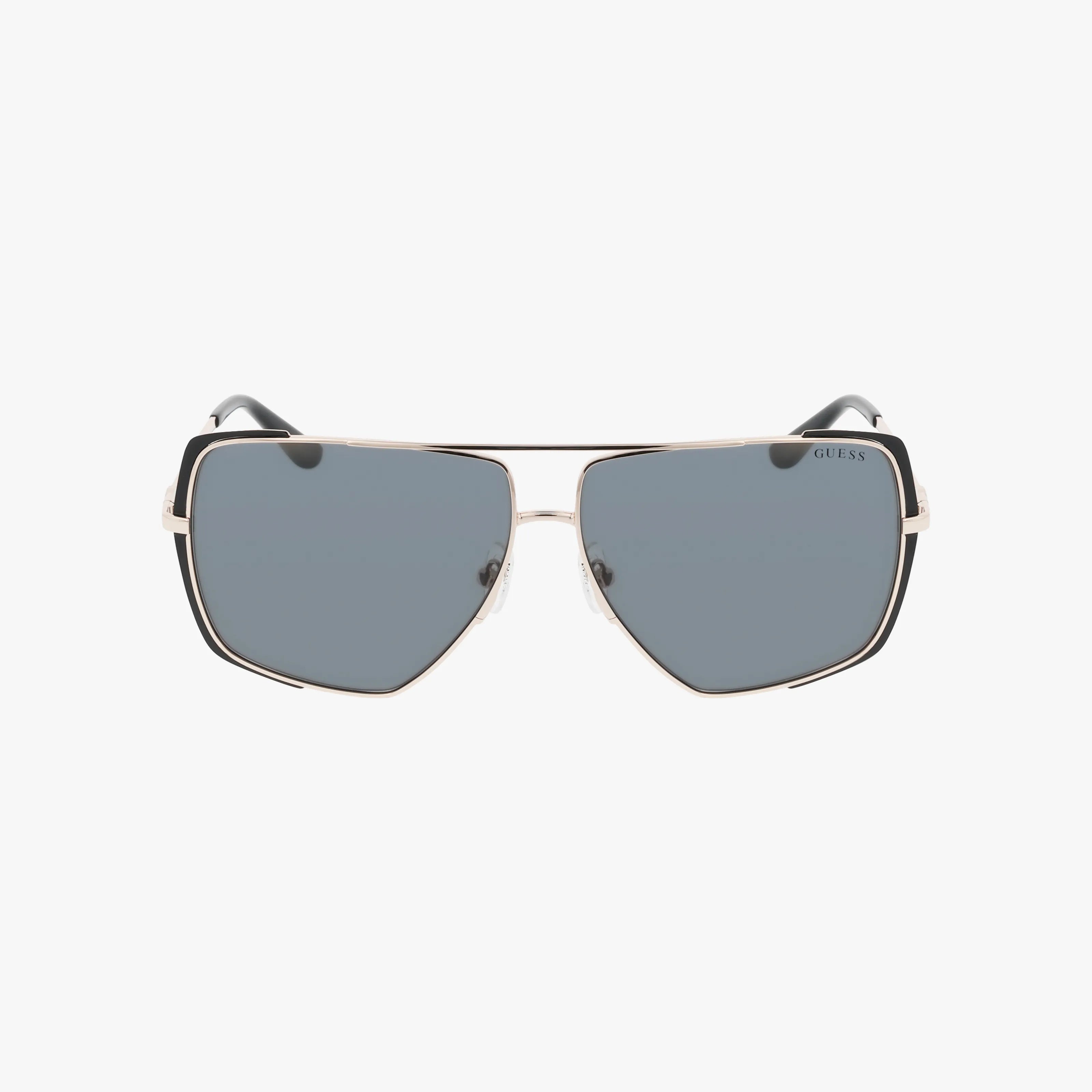 The GU00220 features sophisticated aviator-style sunglasses with a gold metal frame, black rims, and dark gray lenses, shown against a plain white background.