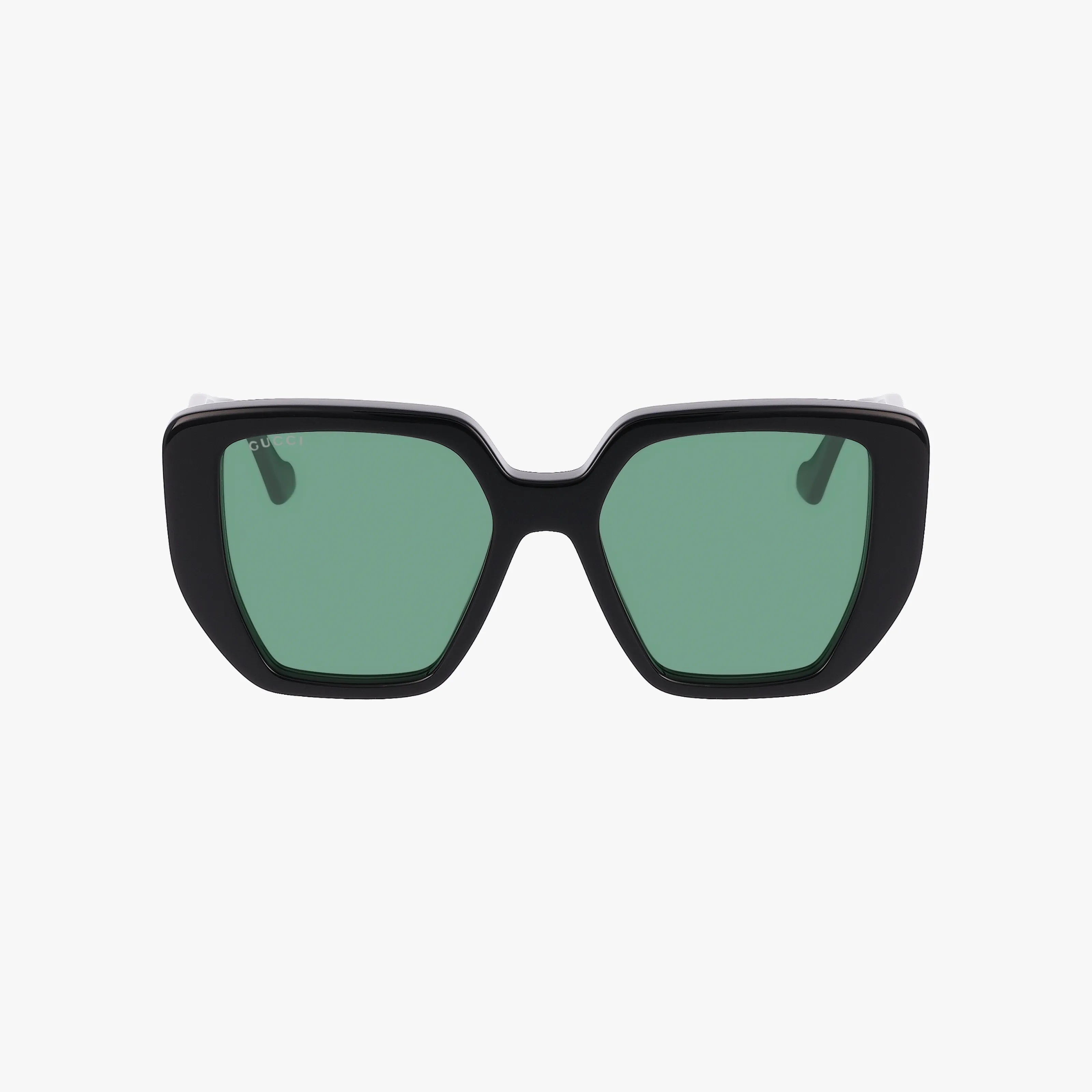 The GG0956S sunglasses feature a black geometric frame and green tinted lenses, shown against a white background.
