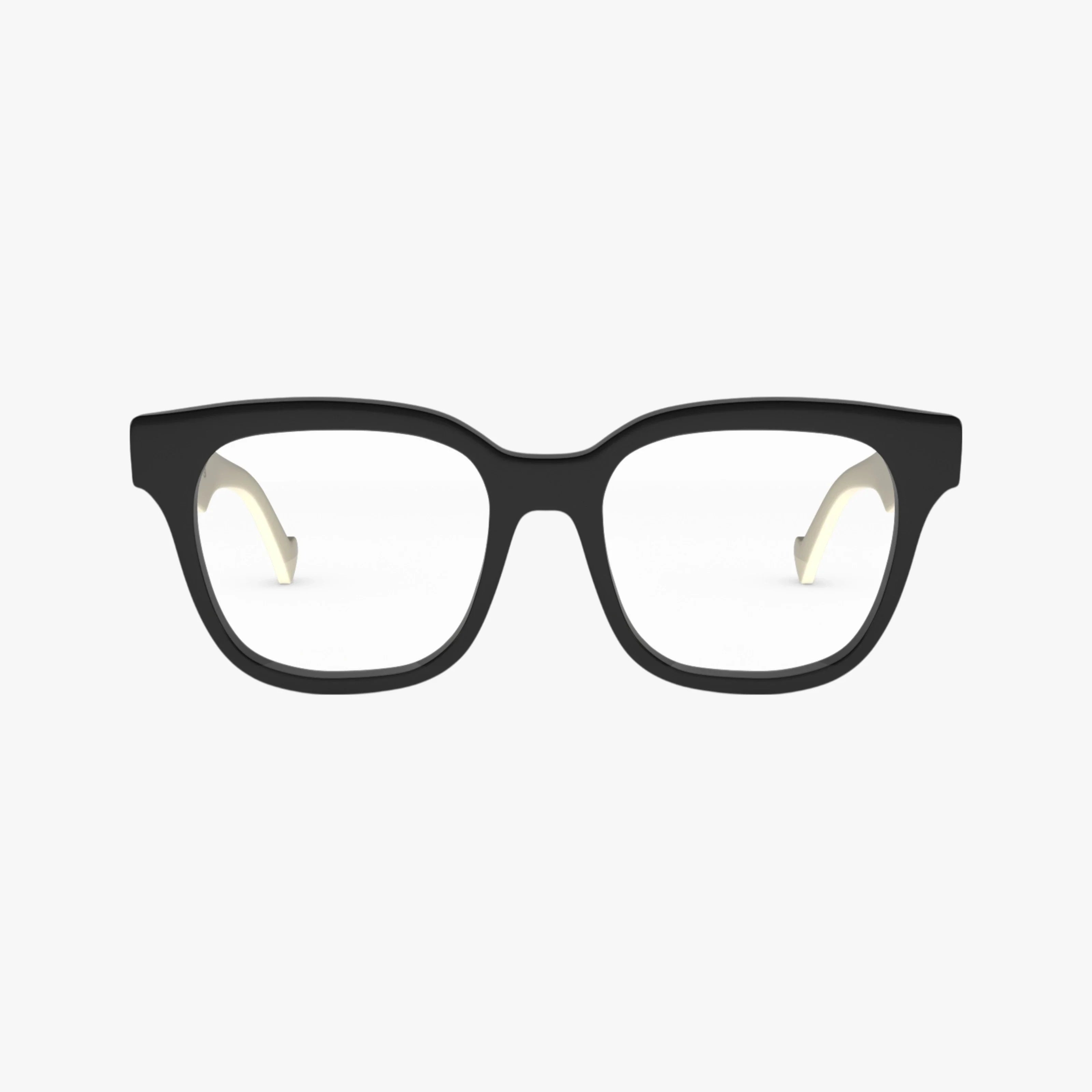 The GG0958O features black rectangular frames with clear lenses, shown front-facing on a white background. Light-colored inner temples add a stylish touch to this sophisticated pair of Gucci eyeglasses.