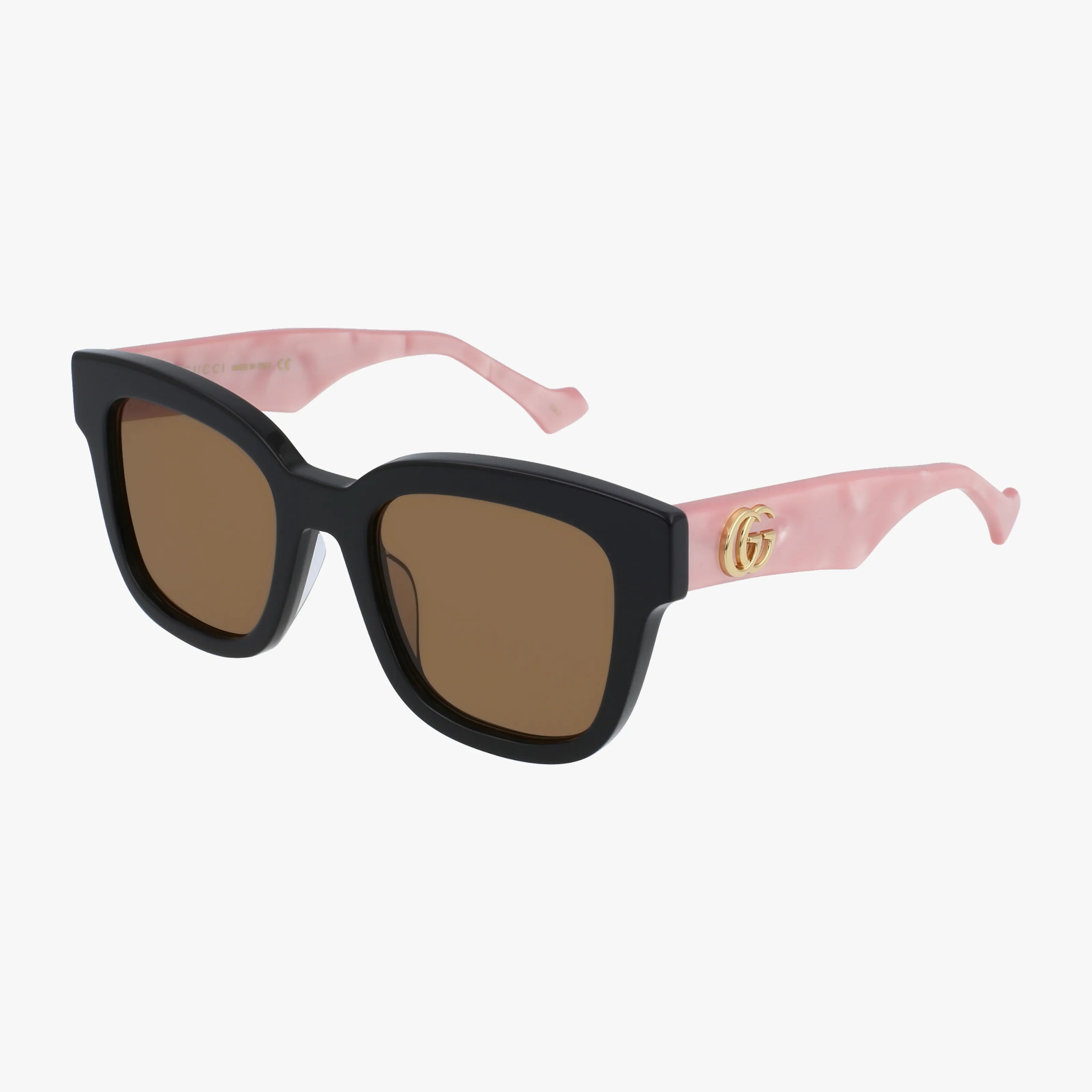 The Gucci GG0998S sunglasses feature thick black square frames, brown lenses, and pink marbled arms accented with a gold GG logo, adding luxurious style to any outfit.