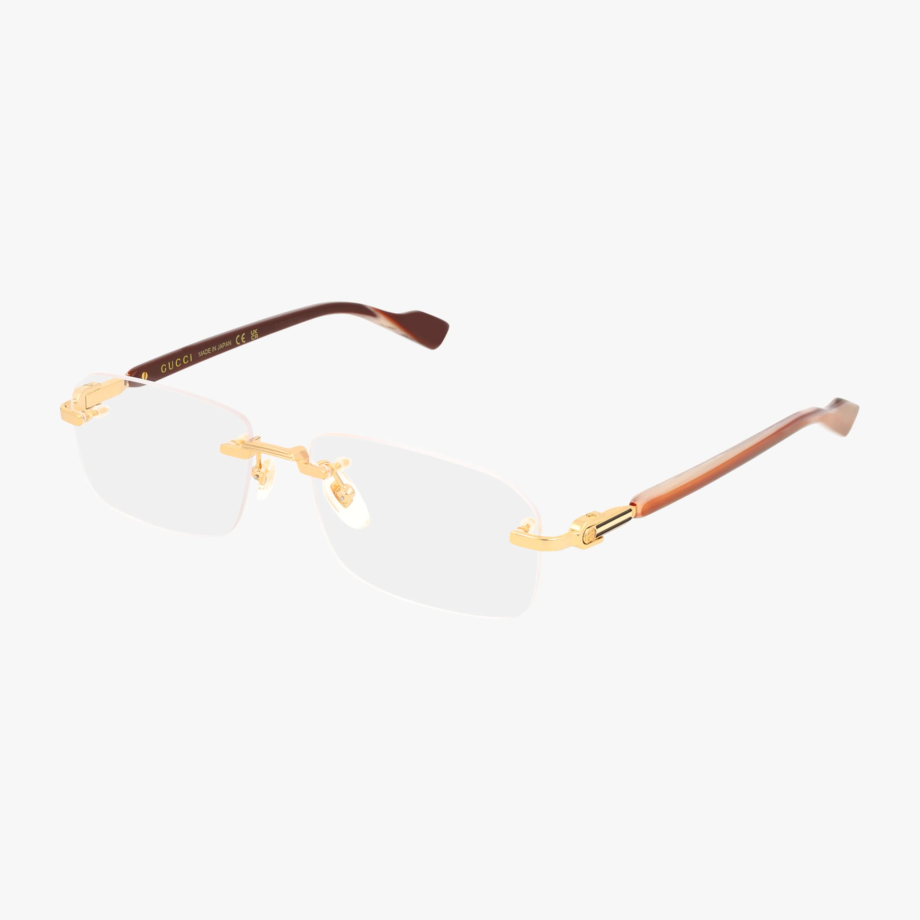 GG1221O gold-rimmed, rectangular rimless eyeglasses feature brown gradient arms and clear nose pads, offering a tailored look for modern eyewear lovers, shown against a white background.