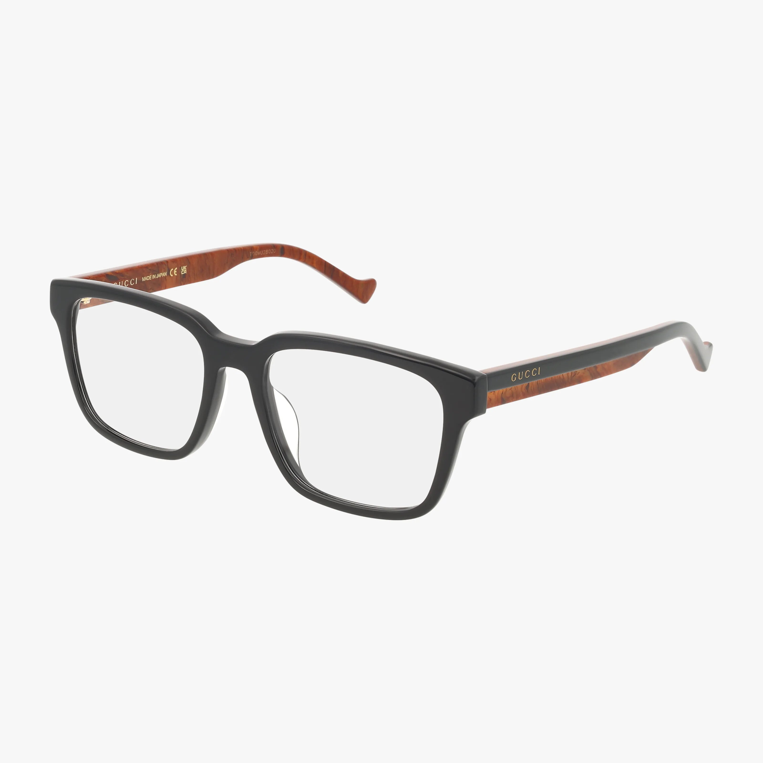 The GG1306OA features rectangular black frames with brown temples, a wood-like inner texture, and the gold Gucci logo on the outer side. Clear lenses make these eyeglasses stylish and versatile.