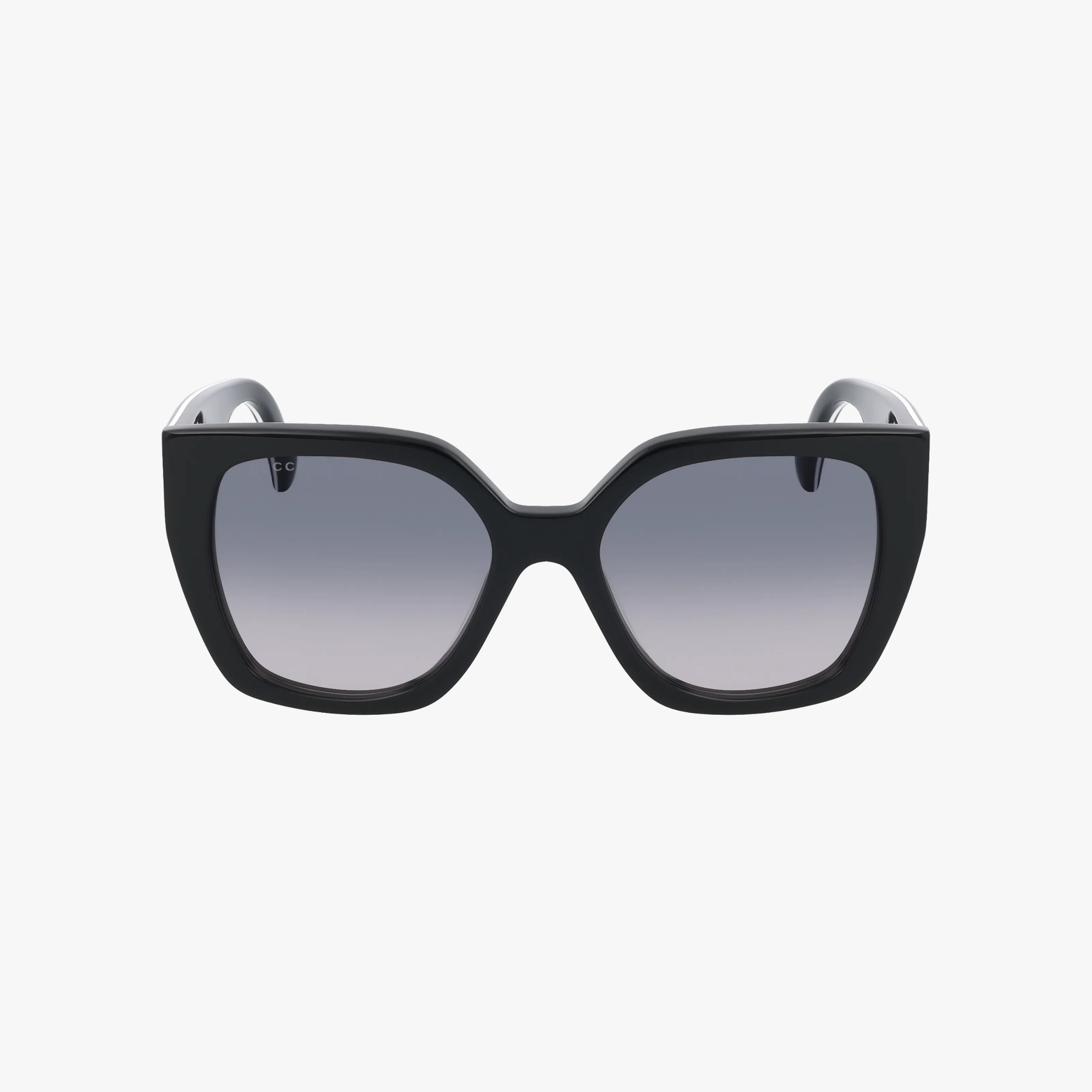 The GG1300S black oversized square sunglasses feature thick frames and dark gradient lenses, embodying modern luxury. Inspired by Gucci GG1300S, they are displayed against a plain white background.