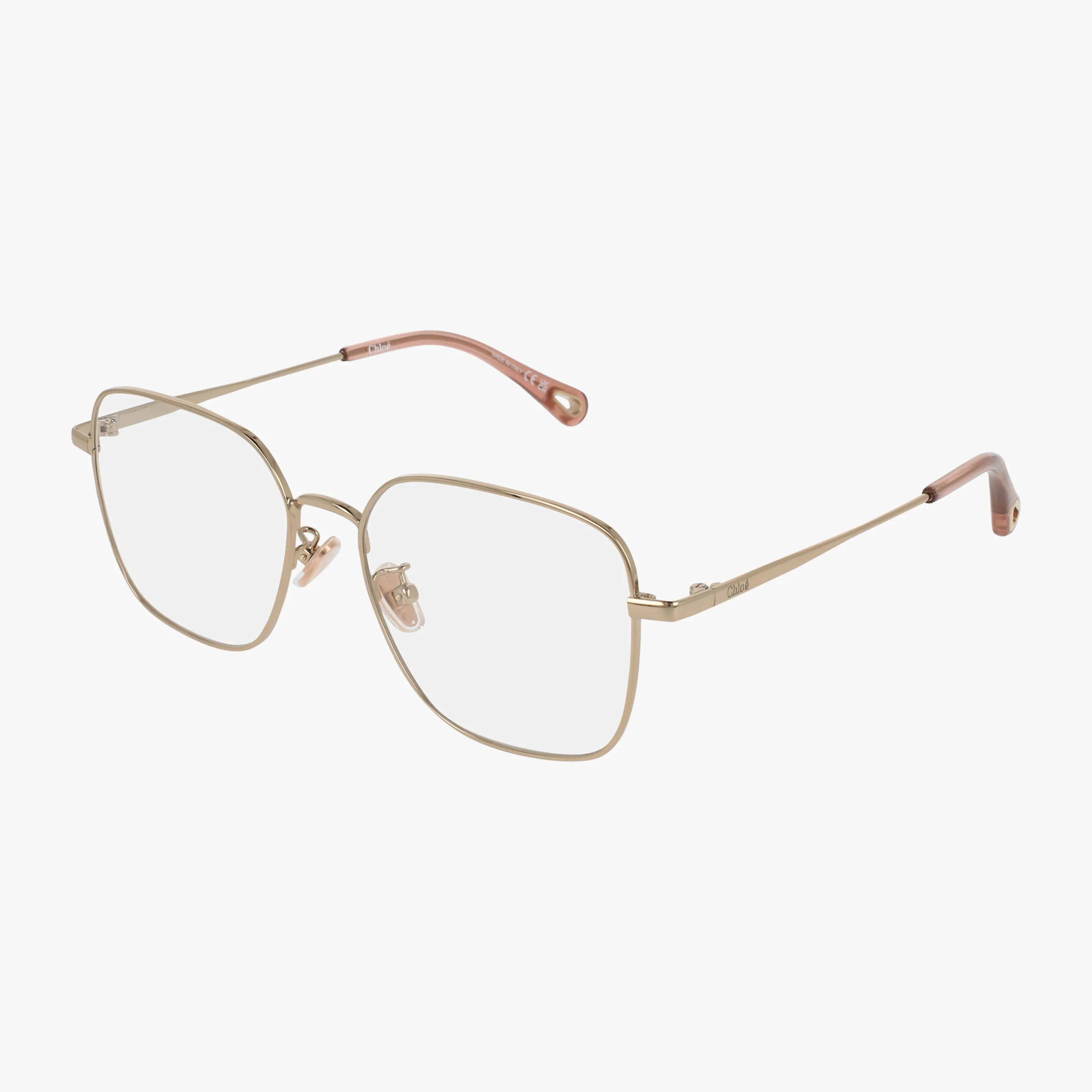 The CH0214OA features thin gold metal frames with large square prescription lenses, clear nose pads, and slender temples finished with pink tips, shown on a white background.