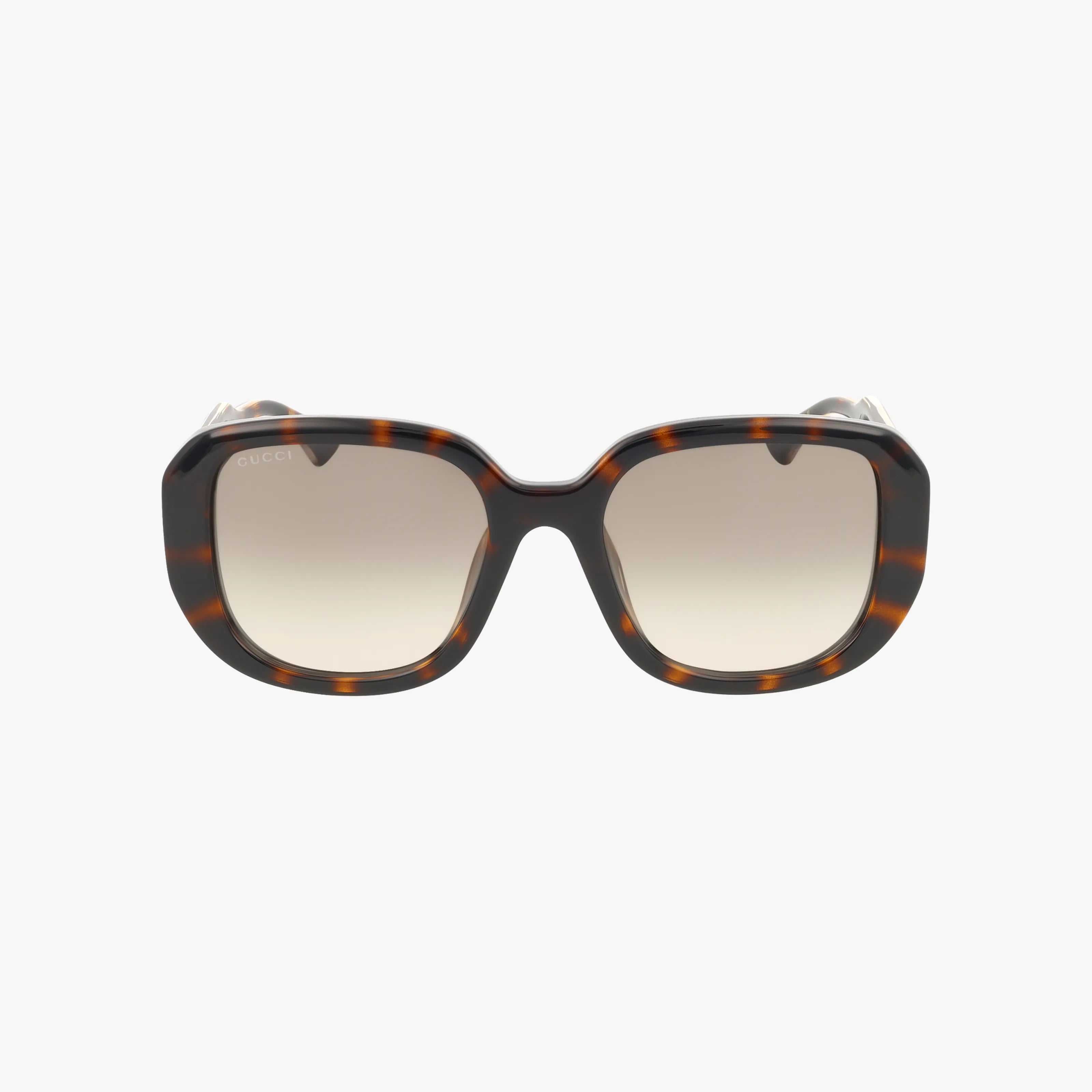 The GG1557SK sunglasses feature square tortoiseshell frames in dark brown and amber with gradient brown lenses, offering a timeless look. Displayed on a plain white background.