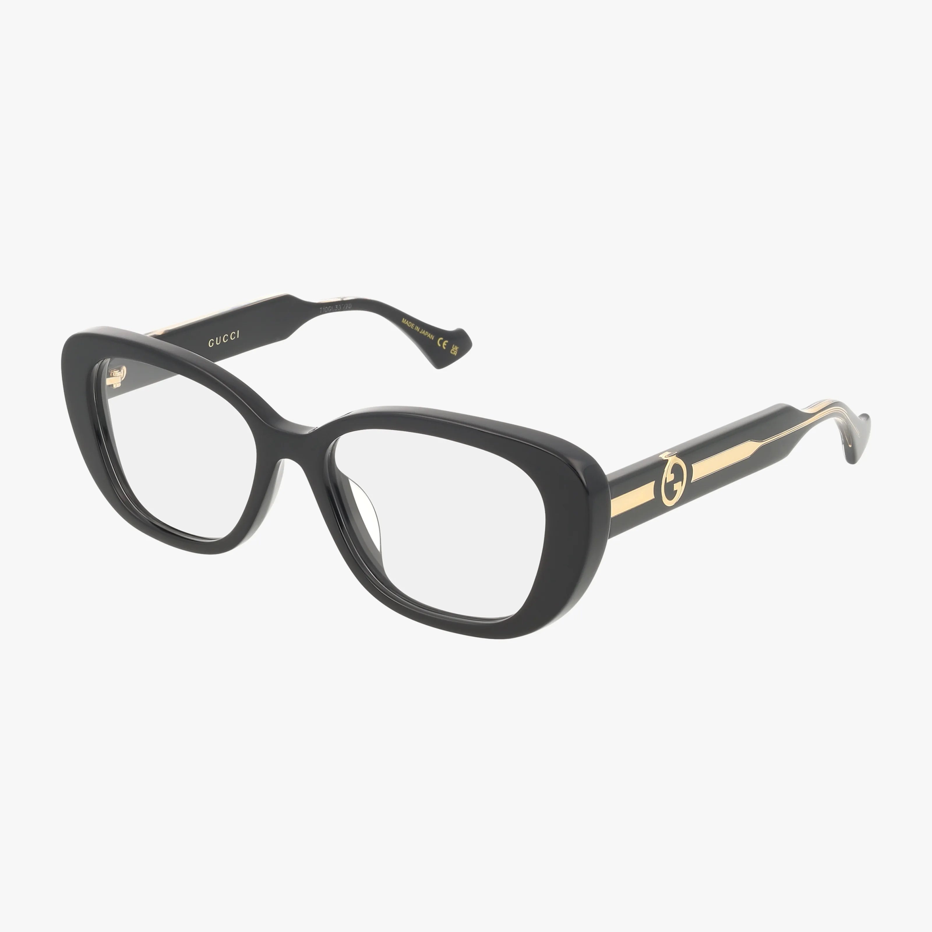 GG1559OK: Black rectangular Gucci eyeglasses with a modern frame, thick durable temples, gold detailing, and the Gucci logo on the sides, shown against a white background.