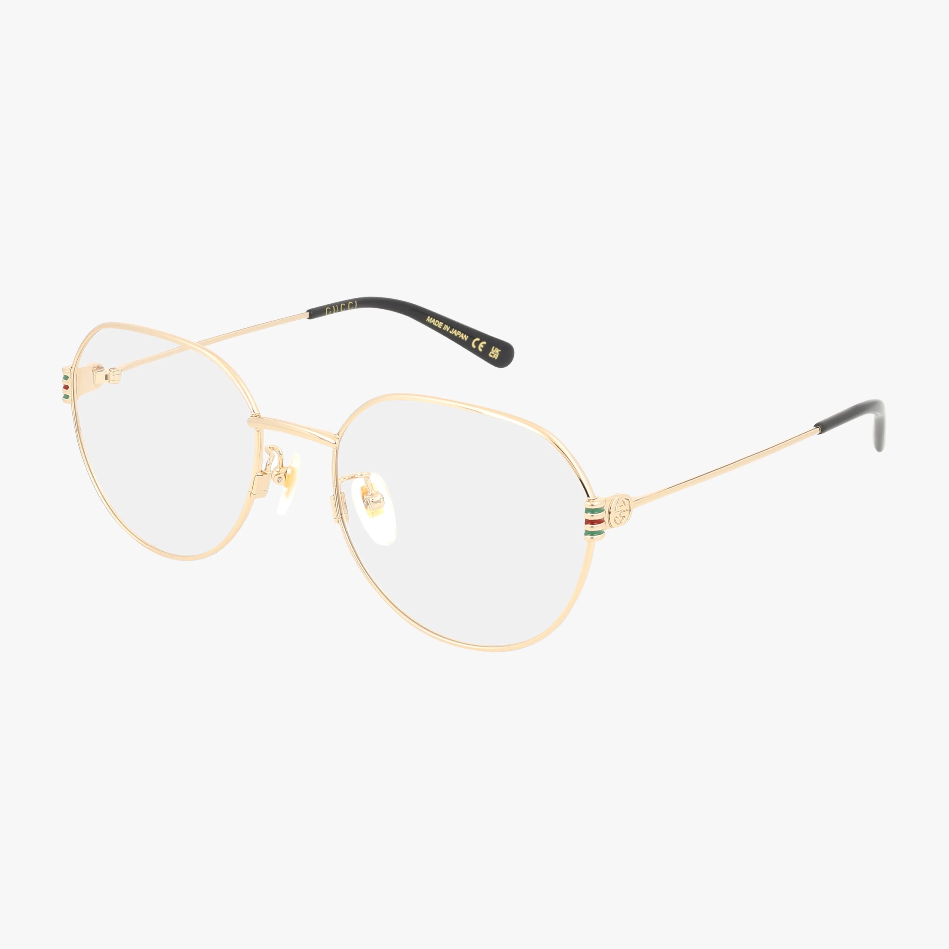 The GG1675OK features gold metal aviator frames with clear lenses, black temple tips, and a small decorative logo on the sides. Its thin, lightweight design delivers distinctive style and comfort for everyday wear.
