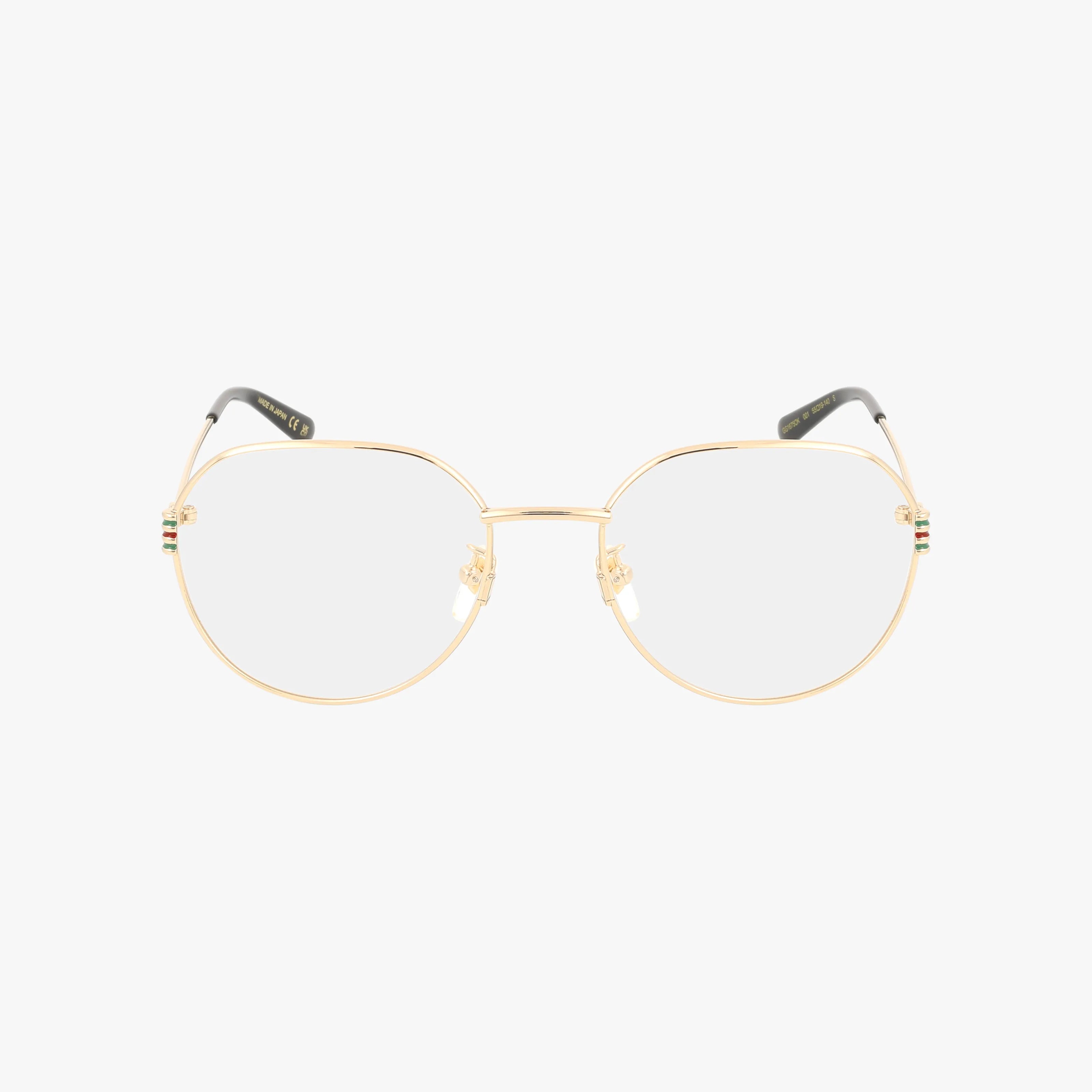 The GG1675OK features gold-rimmed round frames with clear progressive lenses. Black-tipped temples and subtle green and red hinge details enhance this eyeglass’s functional design and unique style. Displayed on a plain white background.