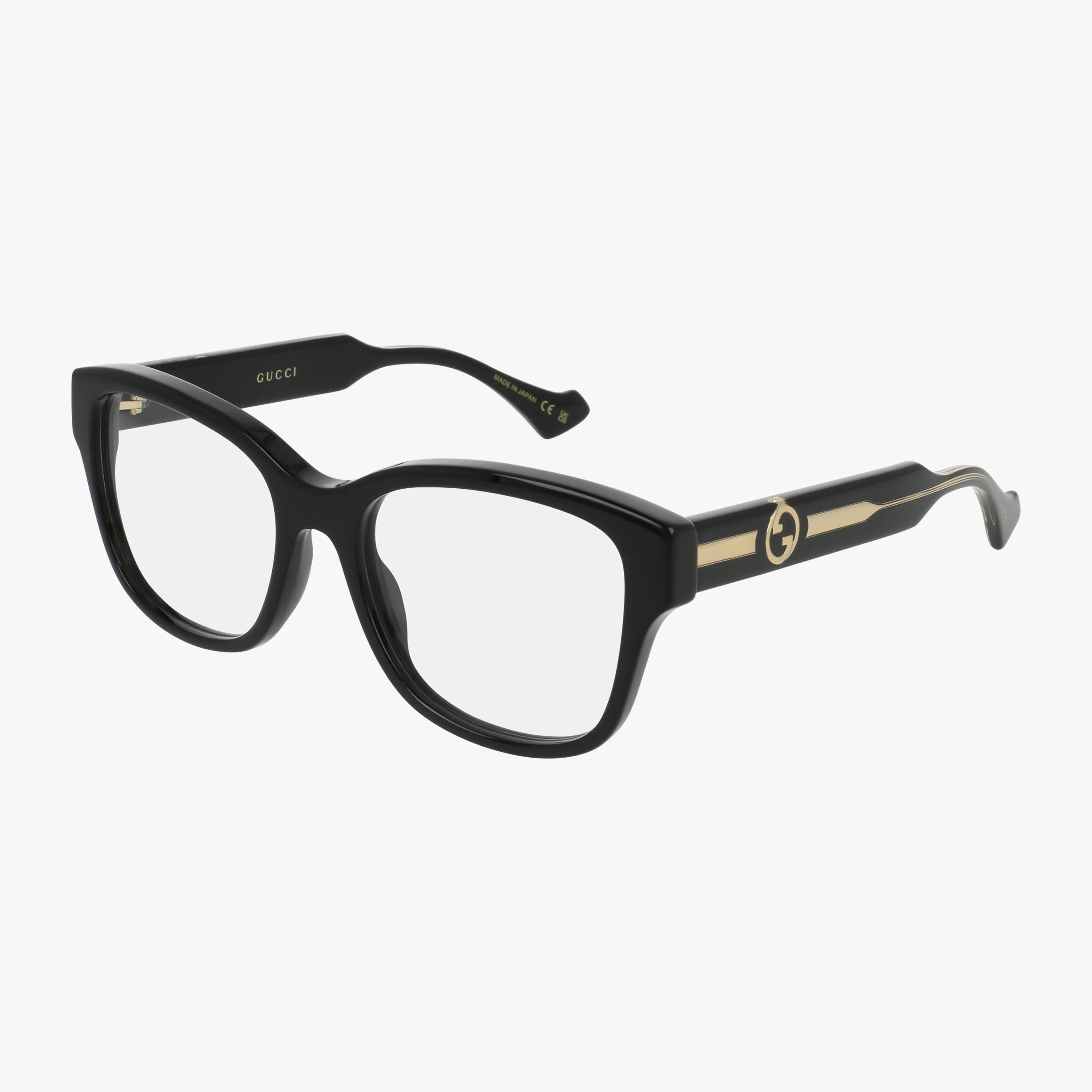GG1775O black rectangular Gucci eyeglasses feature a stylish frame, thick arms, clear lenses, and gold accents. The iconic Gucci logo appears on the temple sides. Displayed against a plain white background.