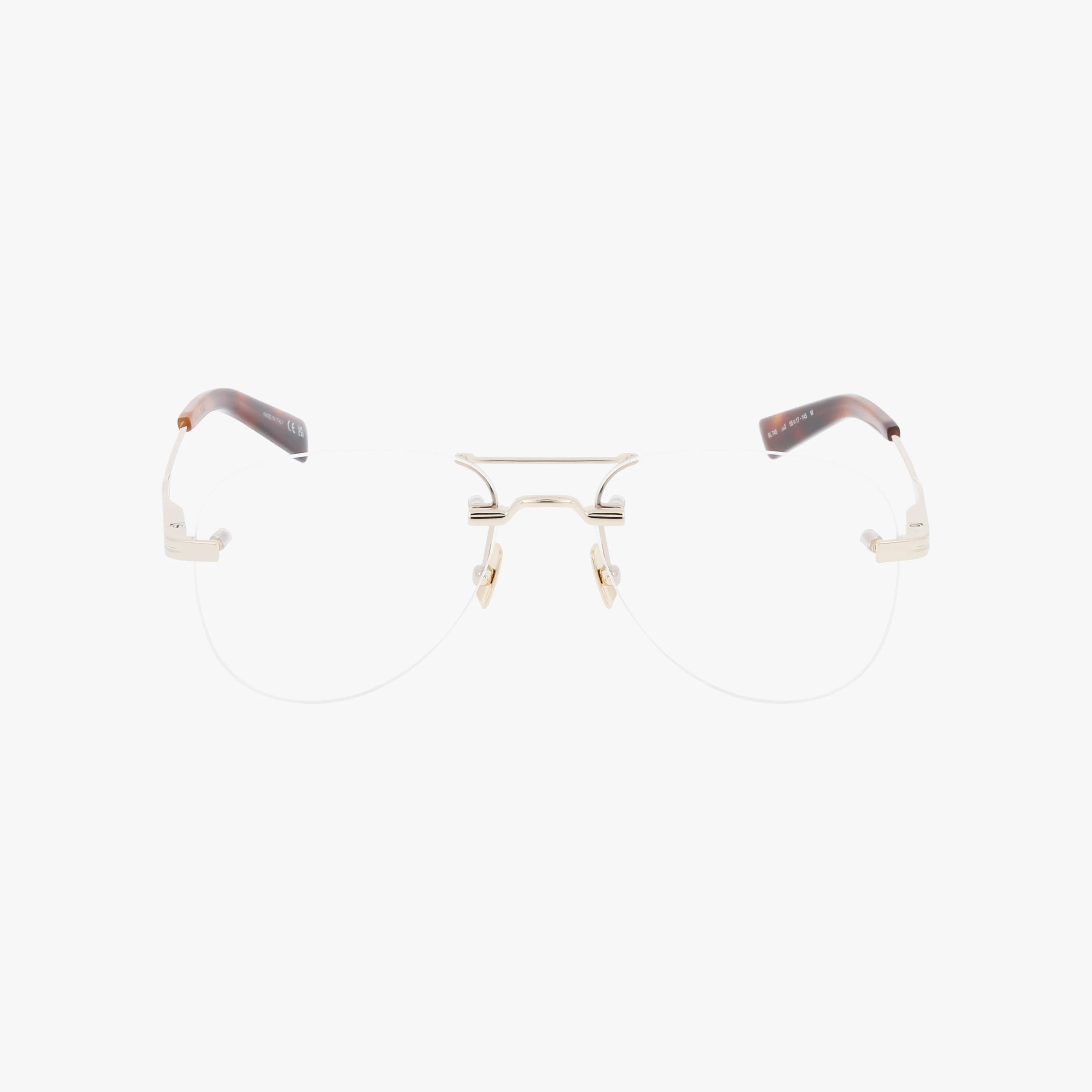 The SL 745 eyeglasses feature a minimalist, rimless design with a thin metallic bridge and temples, transparent nose pads, and brown temple tips. This durable frame offers everyday comfort and style, shown against a plain white background.