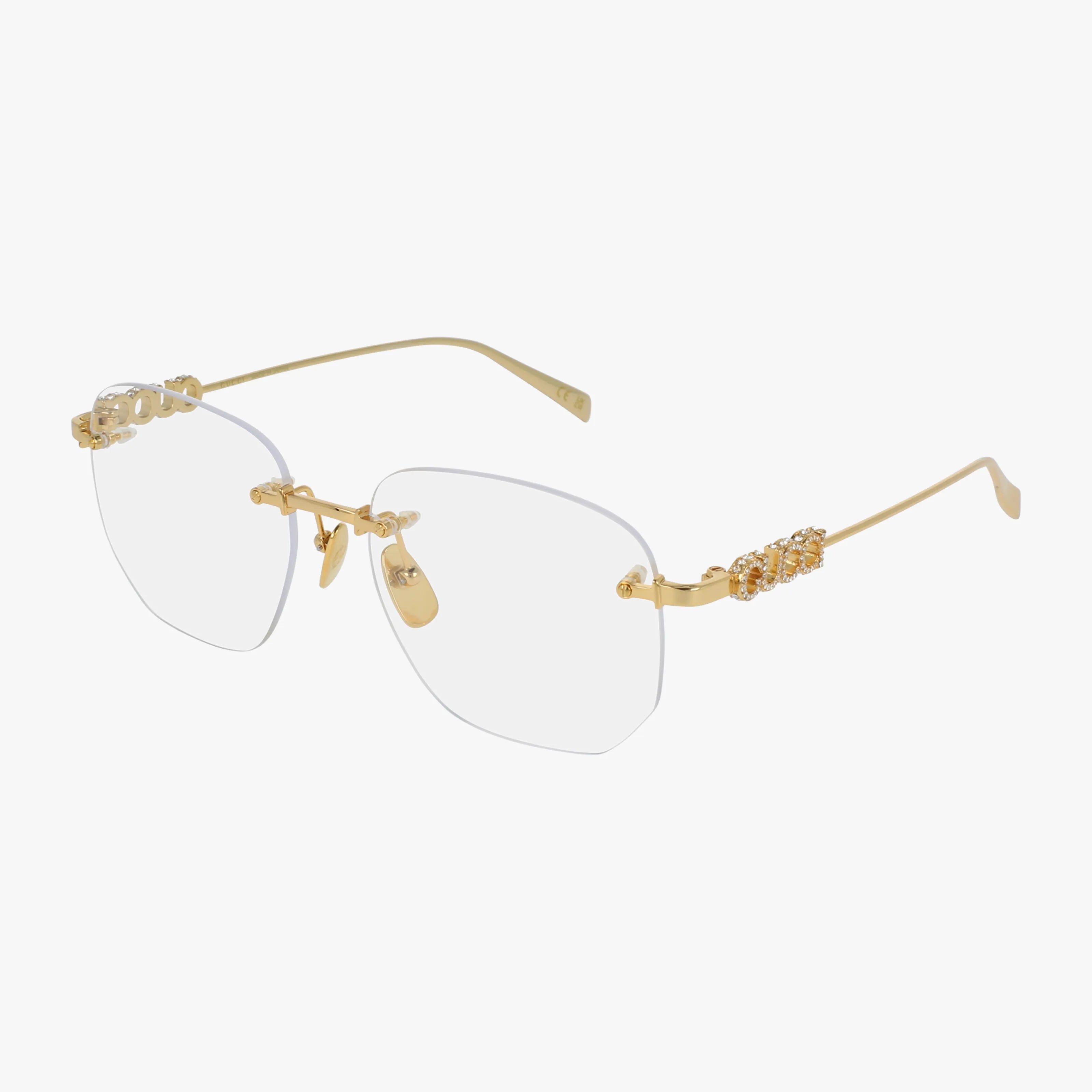 The GG1806O is a pair of rimless eyewear with gold metal temples and jeweled accents on the front corners and temples, featuring a versatile frame suitable for prescription lenses.