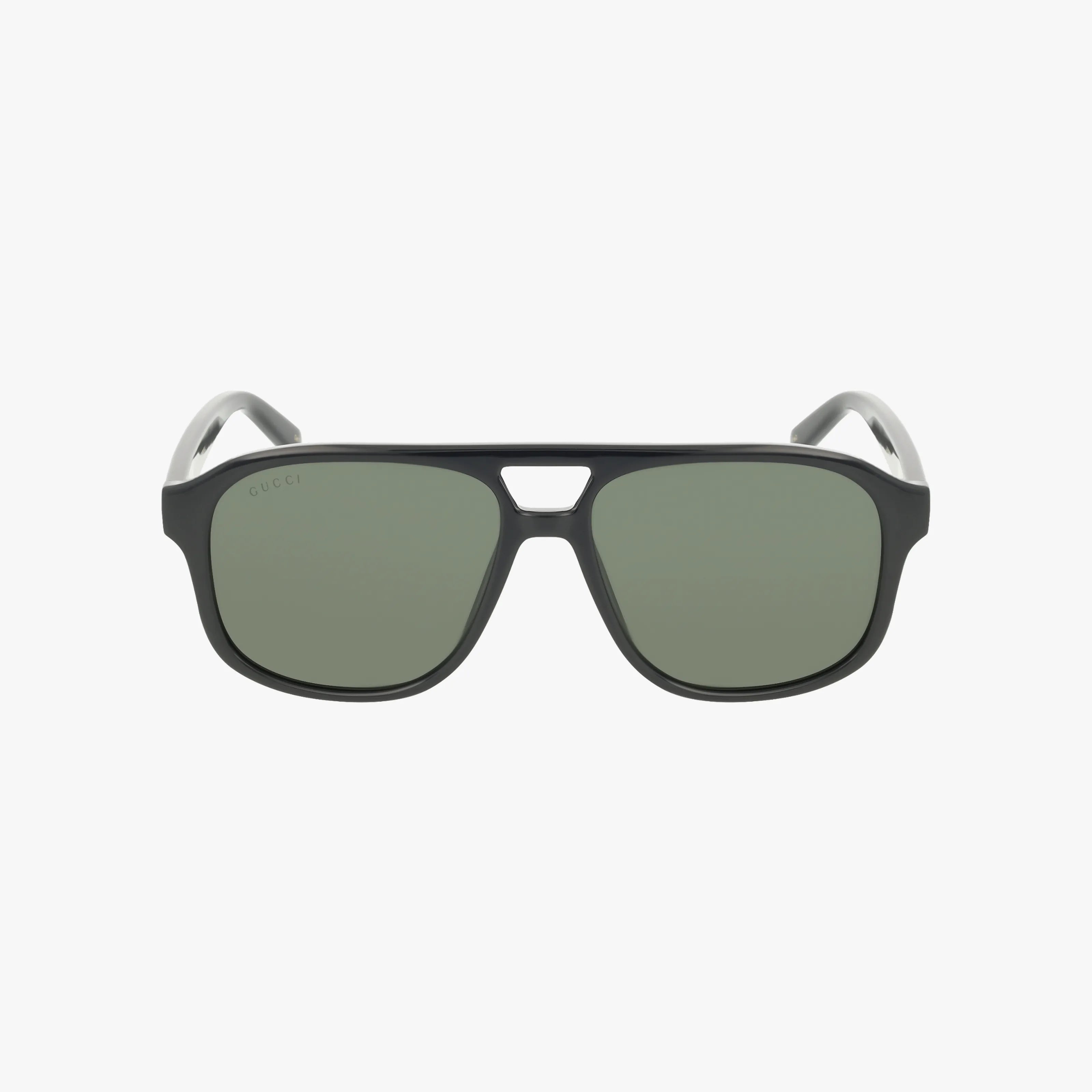 Front view of GG1856S black rectangular sunglasses featuring green-tinted lenses and a small triangular cut-out at the bridge. The temples are white, curve outward, and the background is plain white.