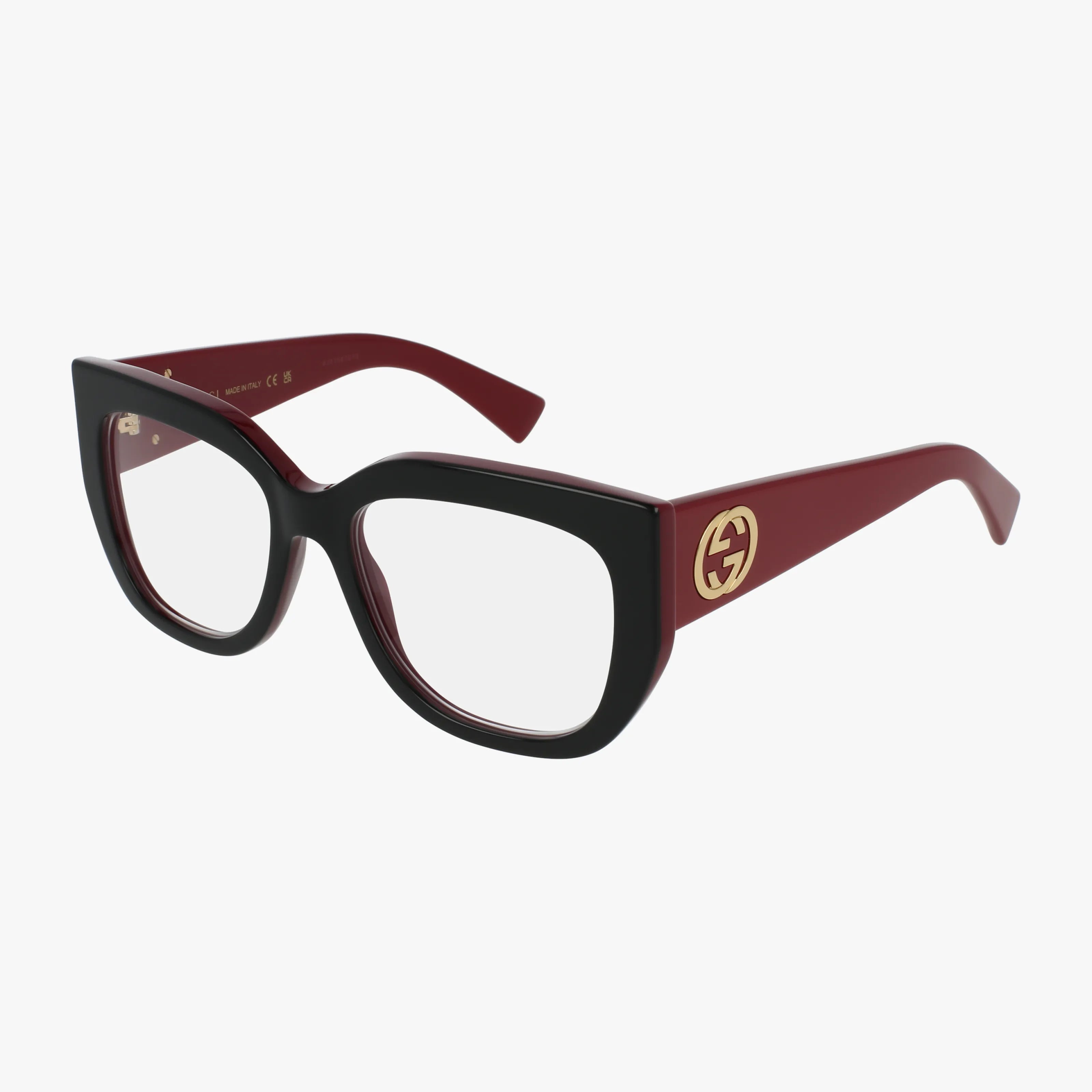 The GG1846O features square black and burgundy eyeglasses with a well-balanced, thick stylish frame, clear lenses, and gold Gucci temple logos, all showcased on a white background.