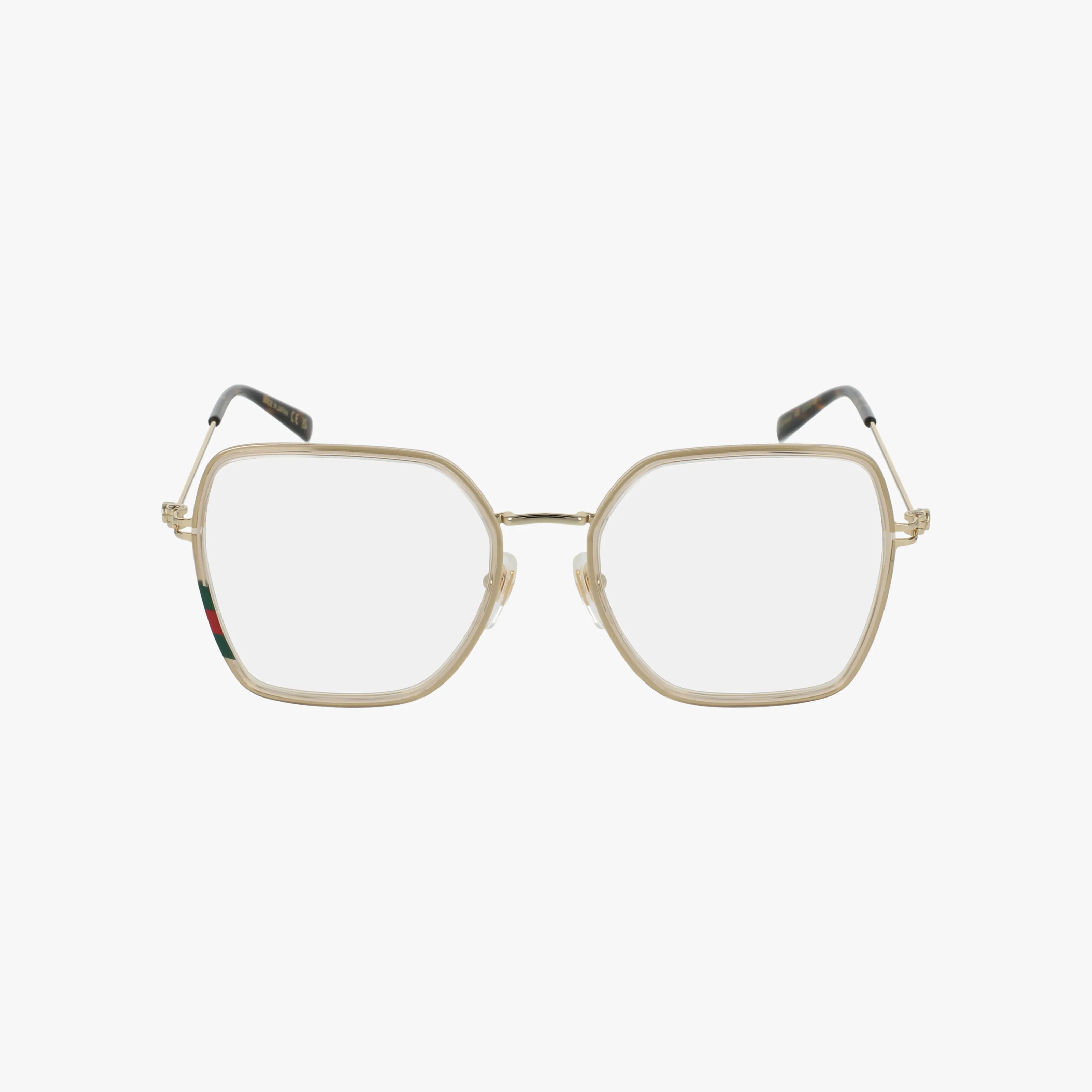 The GG1850O gold-framed eyeglasses feature large geometric square lenses, thin temples, and a subtle red and green accent on the left temple. Perfect for a modern look, these frames offer a tailored fit against a plain white background.