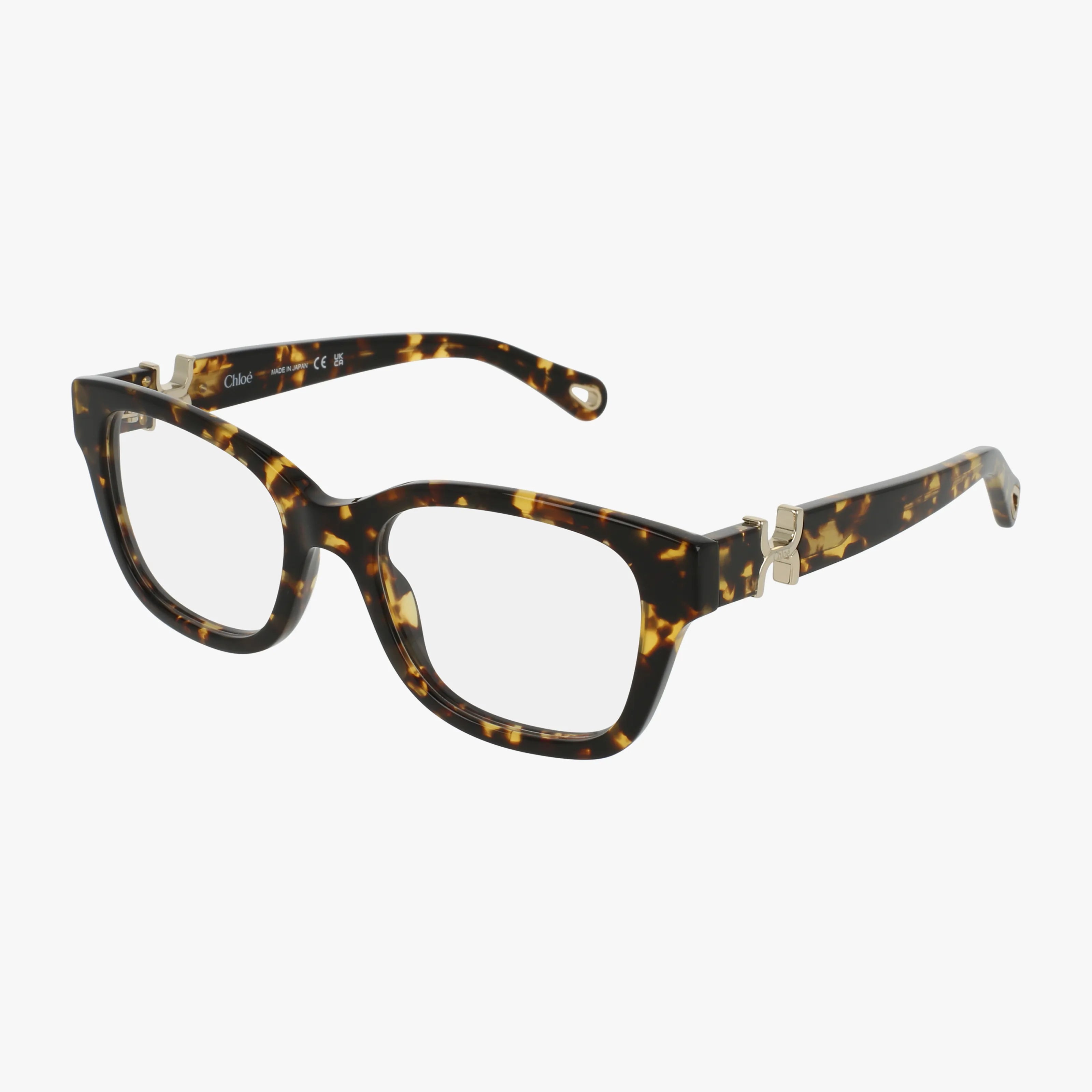 CH0305O rectangular eyeglasses in brown and yellow tortoiseshell feature thick frames, metal hinge accents, and are shown on a white background.